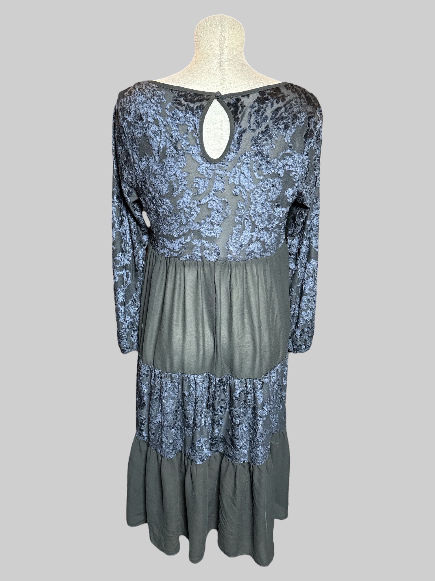 L black, long sleeve dress with balloon sleeves, velvet burnout tiered, design, and keyhole and button on back