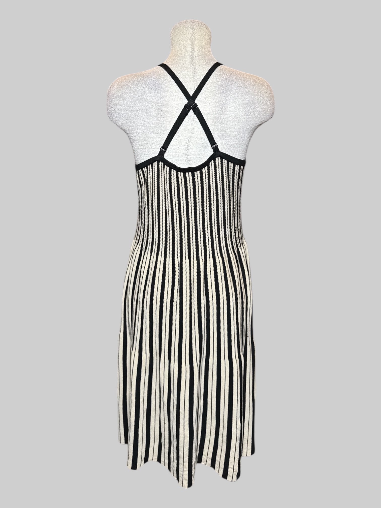 XL black and off-white knit sleeveless dress with crossing adjustable straps, and ruffle design