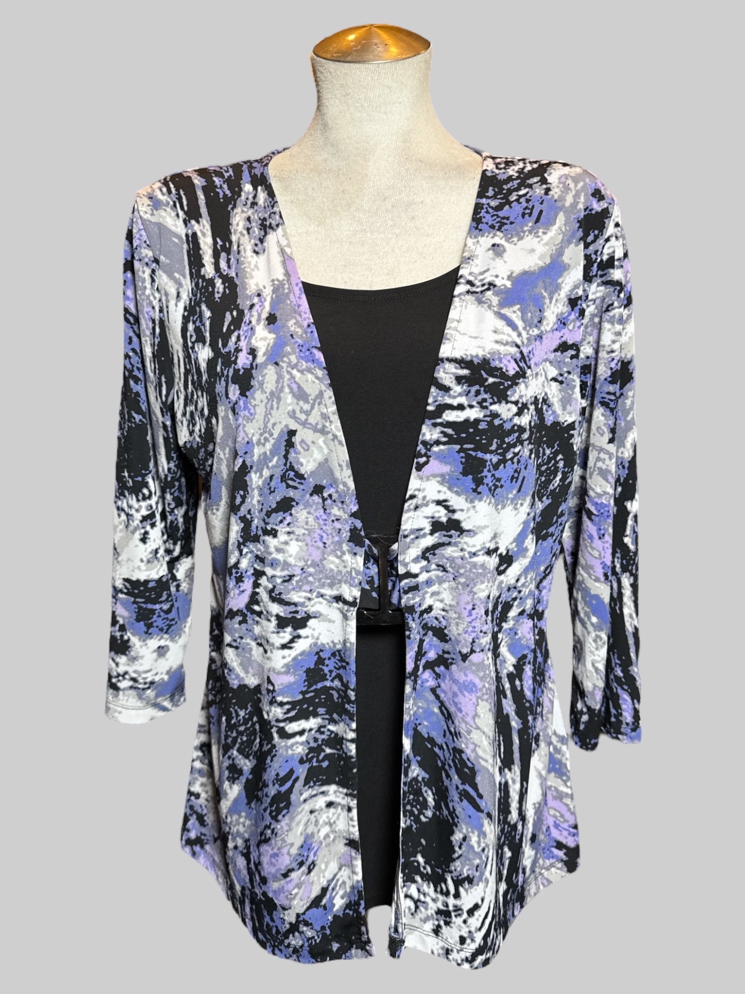 1X purple, white and black long sleeve top with faux cami underneath, and faux buckle