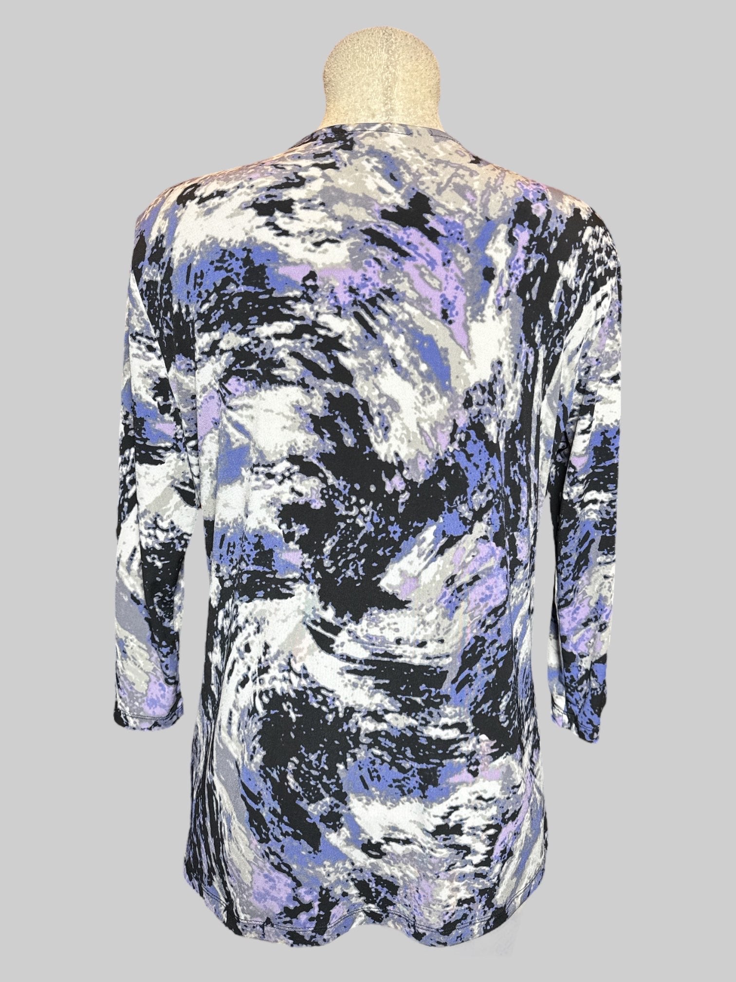 1X purple, white and black long sleeve top with faux cami underneath, and faux buckle