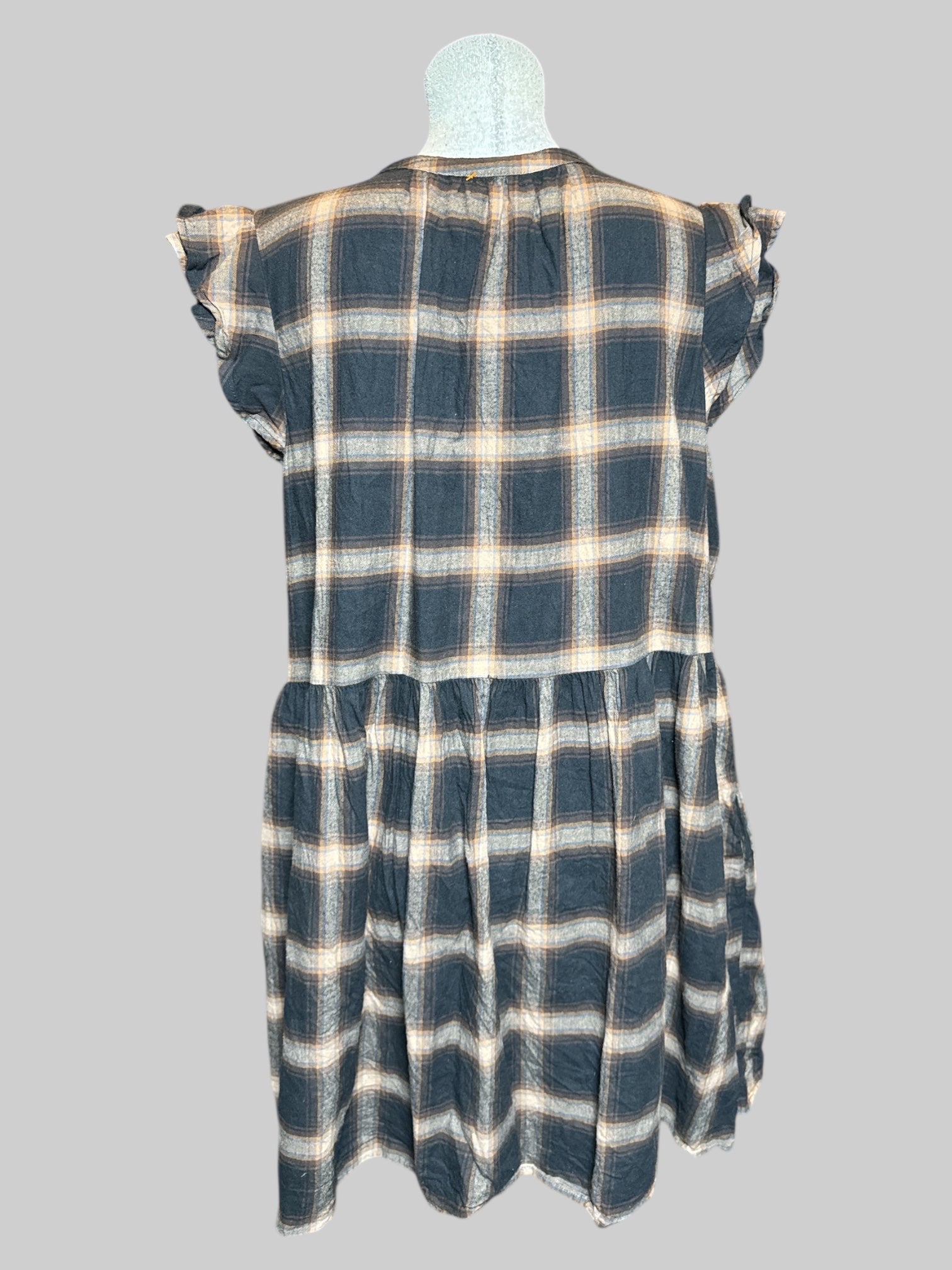 1X black and brown plaid sleeveless dress with ruffle sleeves, half buttons on front, and pockets