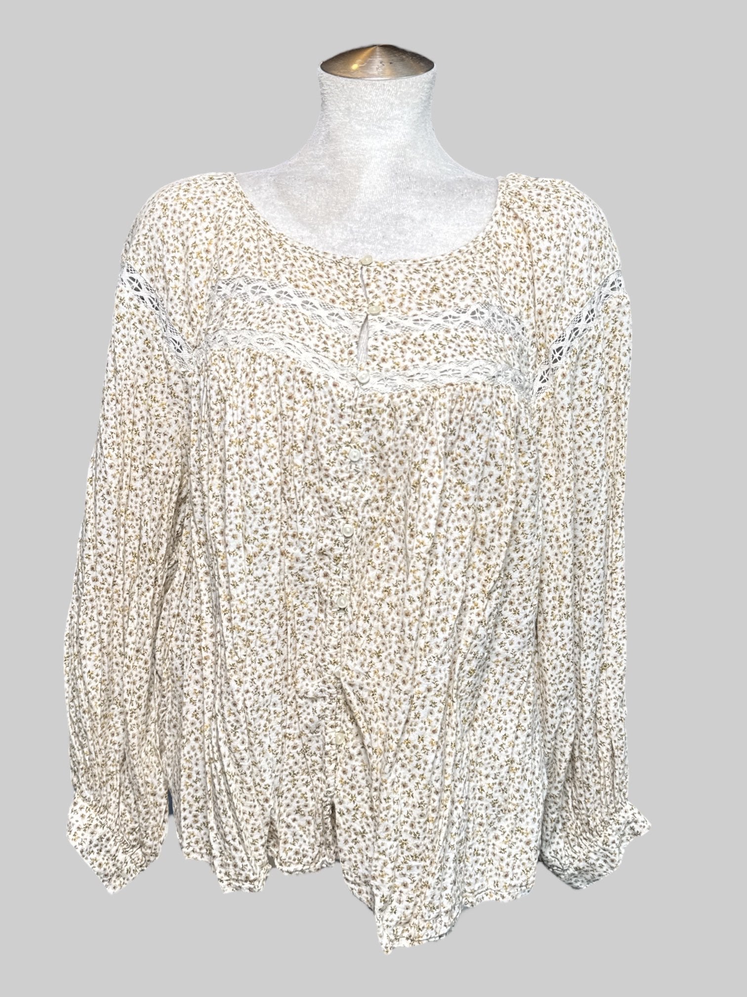 2X cream long sleeve blouse with green and brown florals, lace cut outs, and buttons