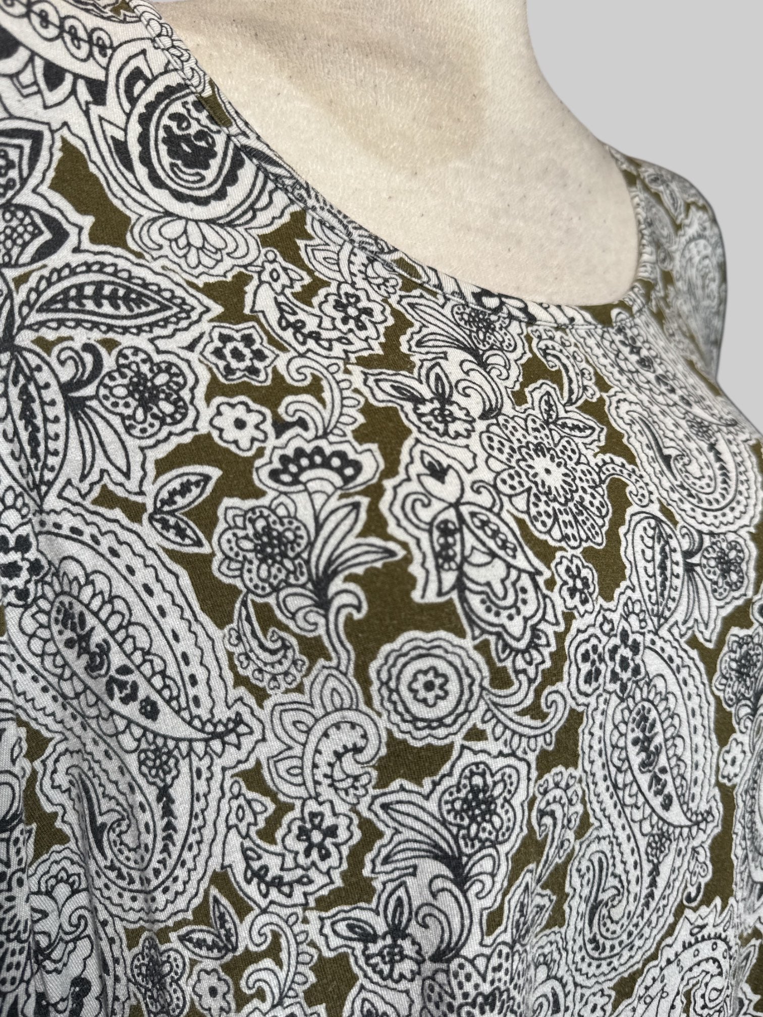 4X greenish brown cold shoulder long sleeve top with white and blue paisley pattern