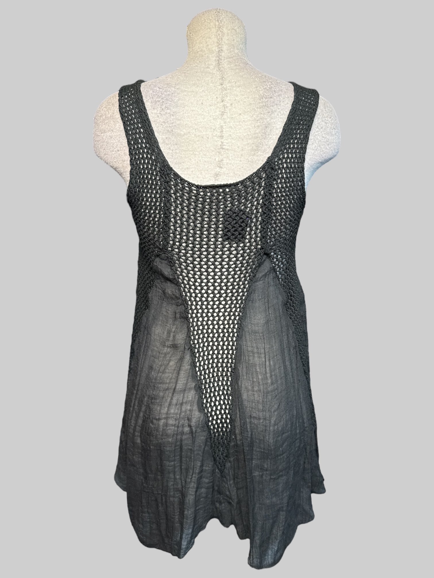 L flowy black loose knit top with sheer black panels