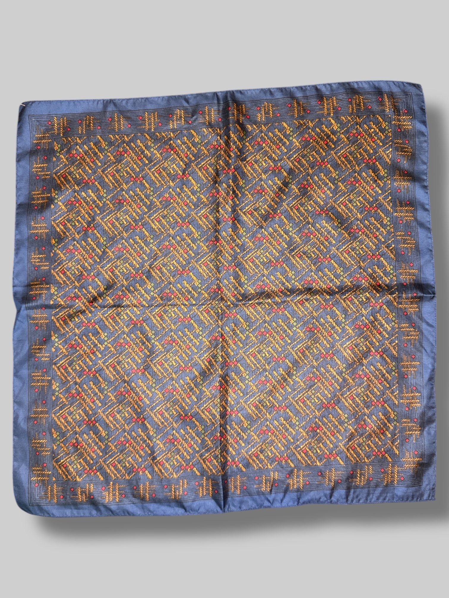 100% silk blue, brown, green, and red colored handkerchief