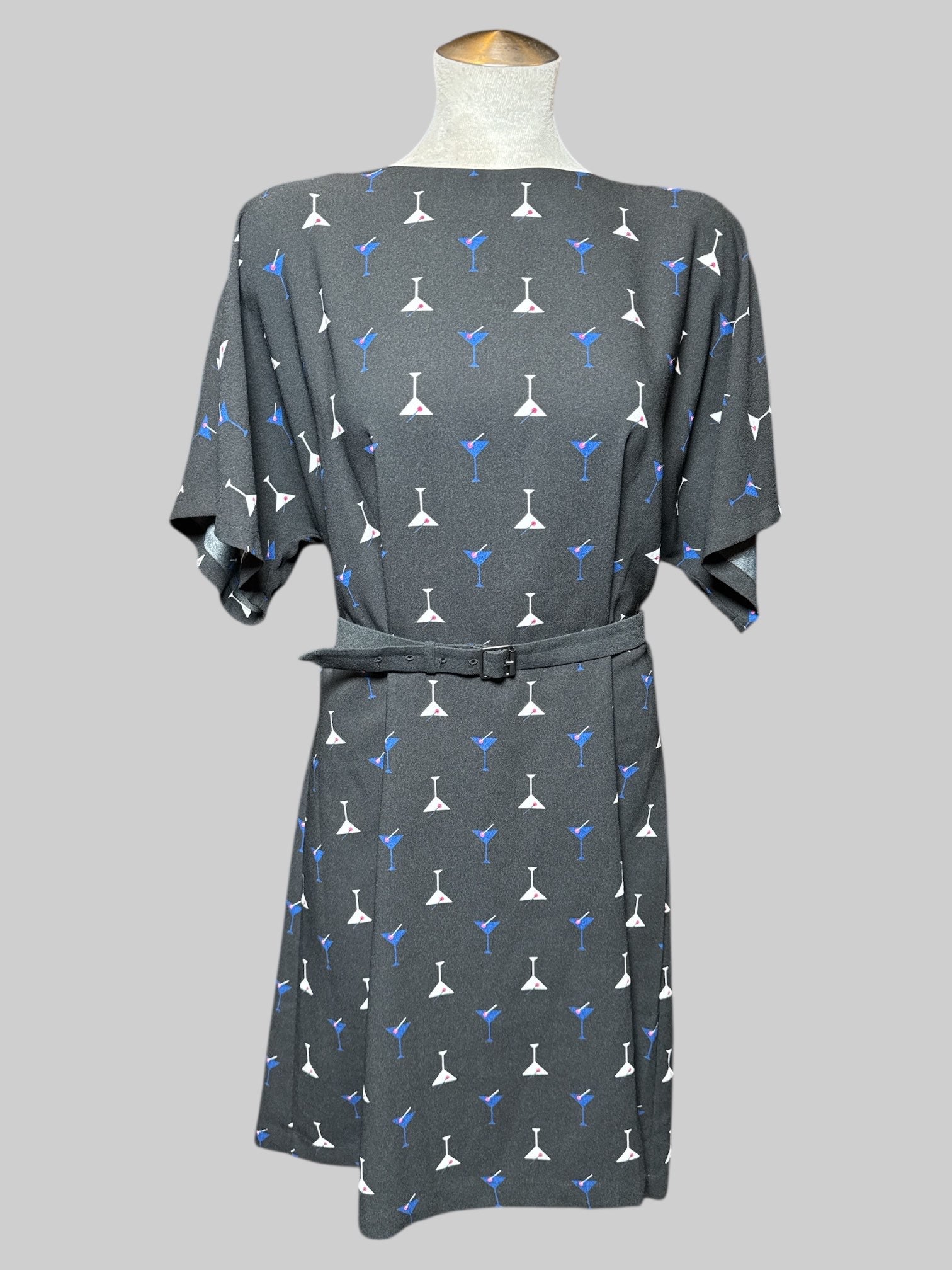 L black, short sleeve dress with multicolor, martini, print, separate belt, and keyhole and button on back