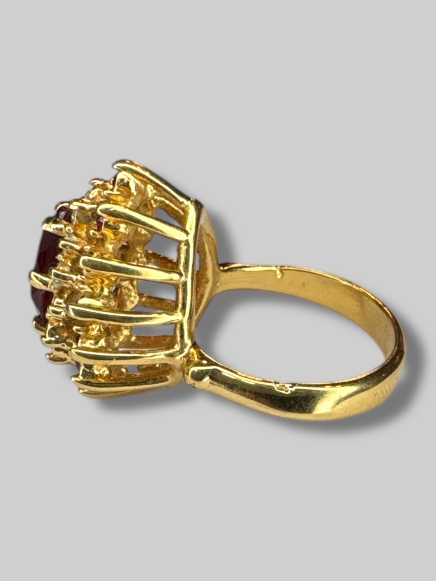 Size 6 gold tone ring with red and white gem stones