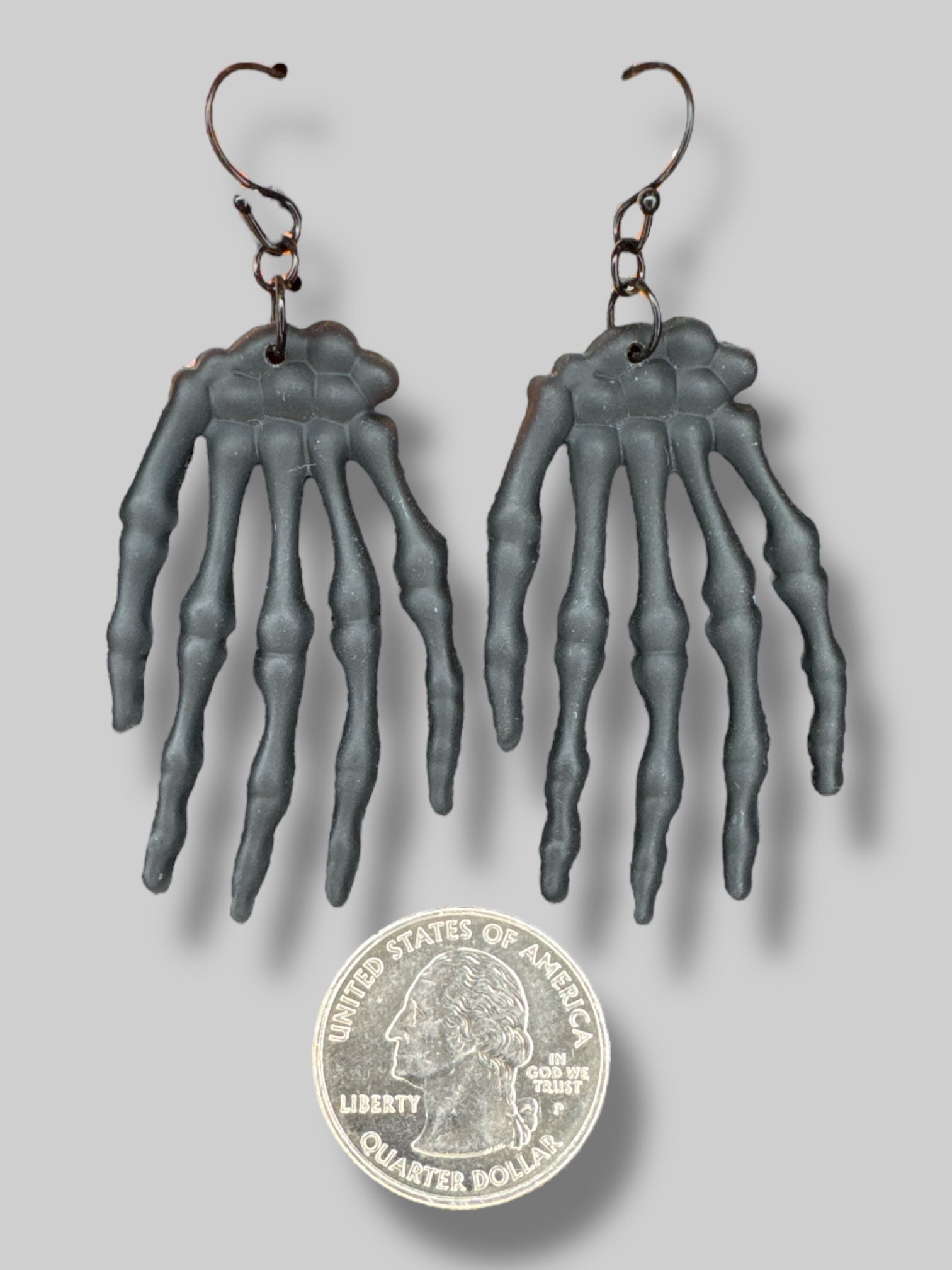 Black skeleton hand earrings