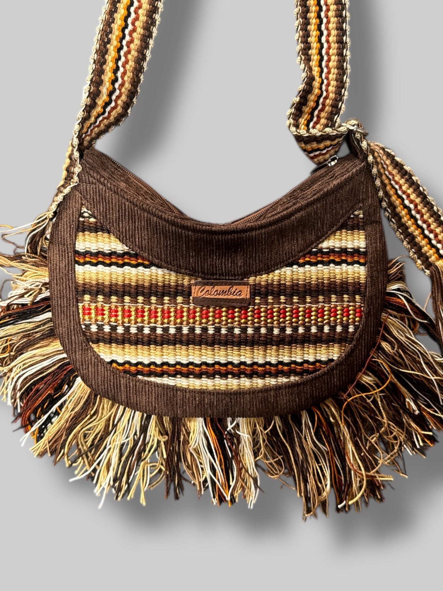 NWT 12” by 9” brown corduroy, fringe, and multicolor knit pattern purse