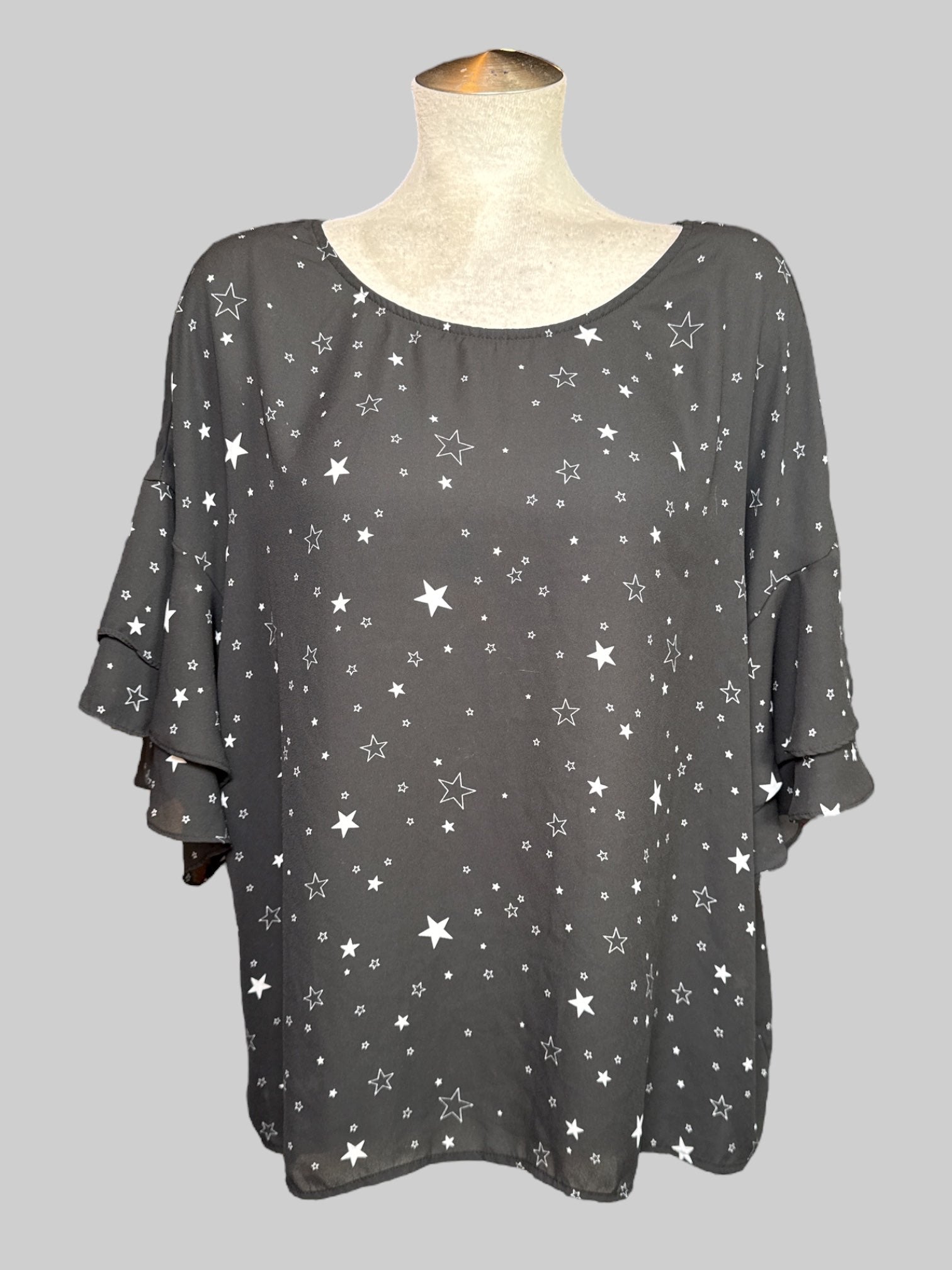 2X black half sleeve top with stars, print, ruffle, layered sleeves, and tie on back neck