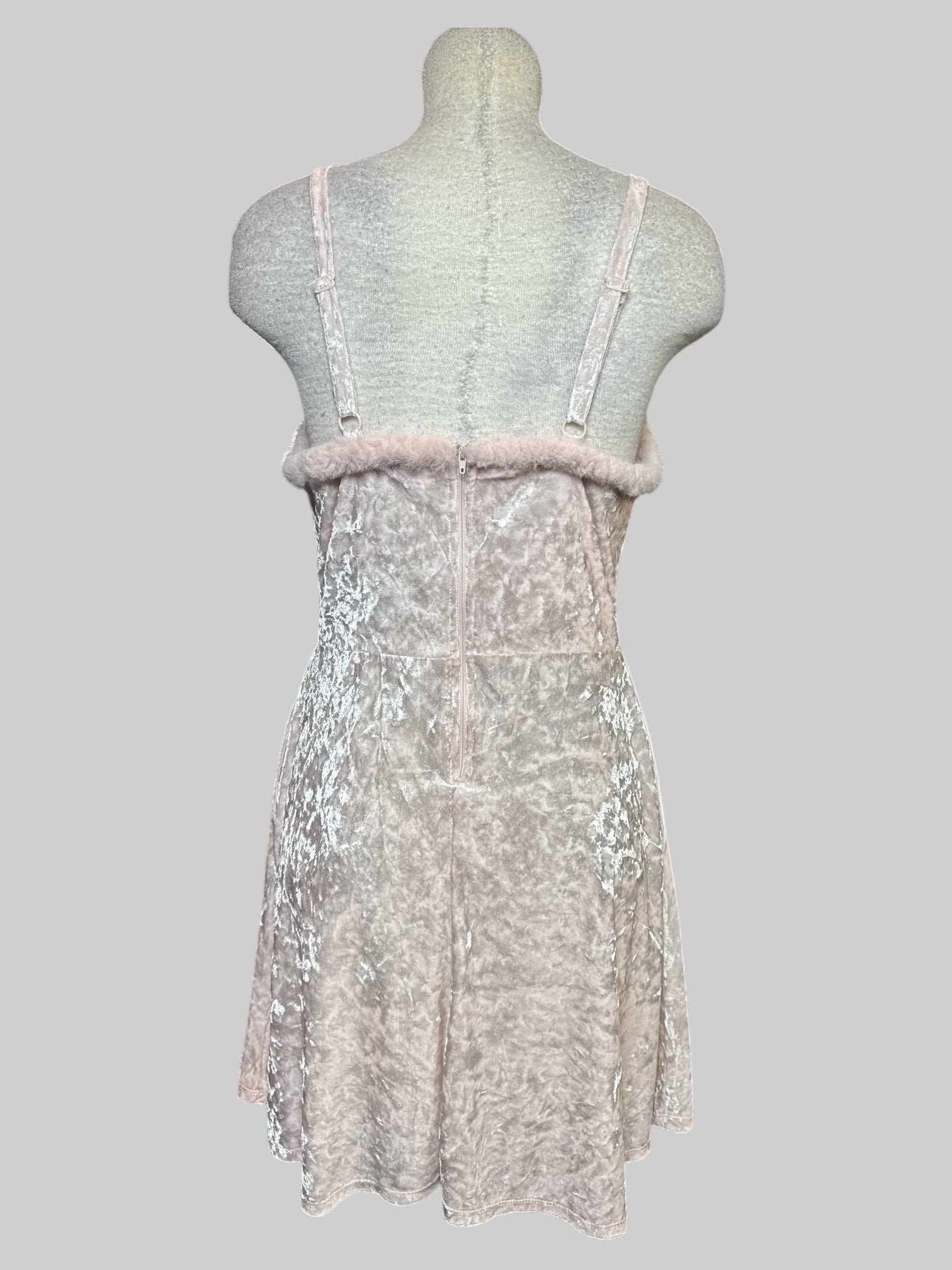 M light pink crushed velvet sleeveless dress with fuzzy hem line, zipper on back, and pockets