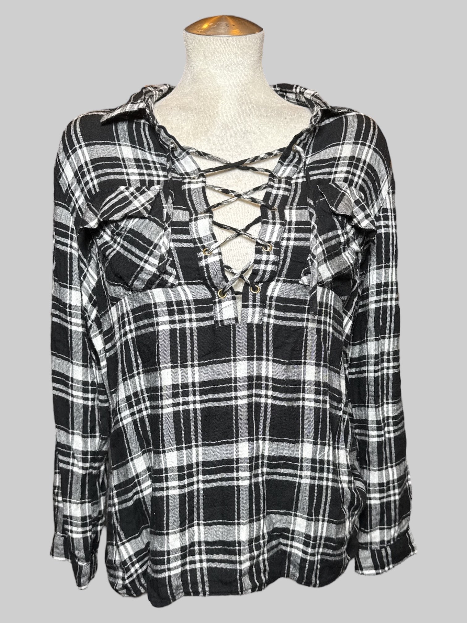 L black and white plaid top with criss cross chest