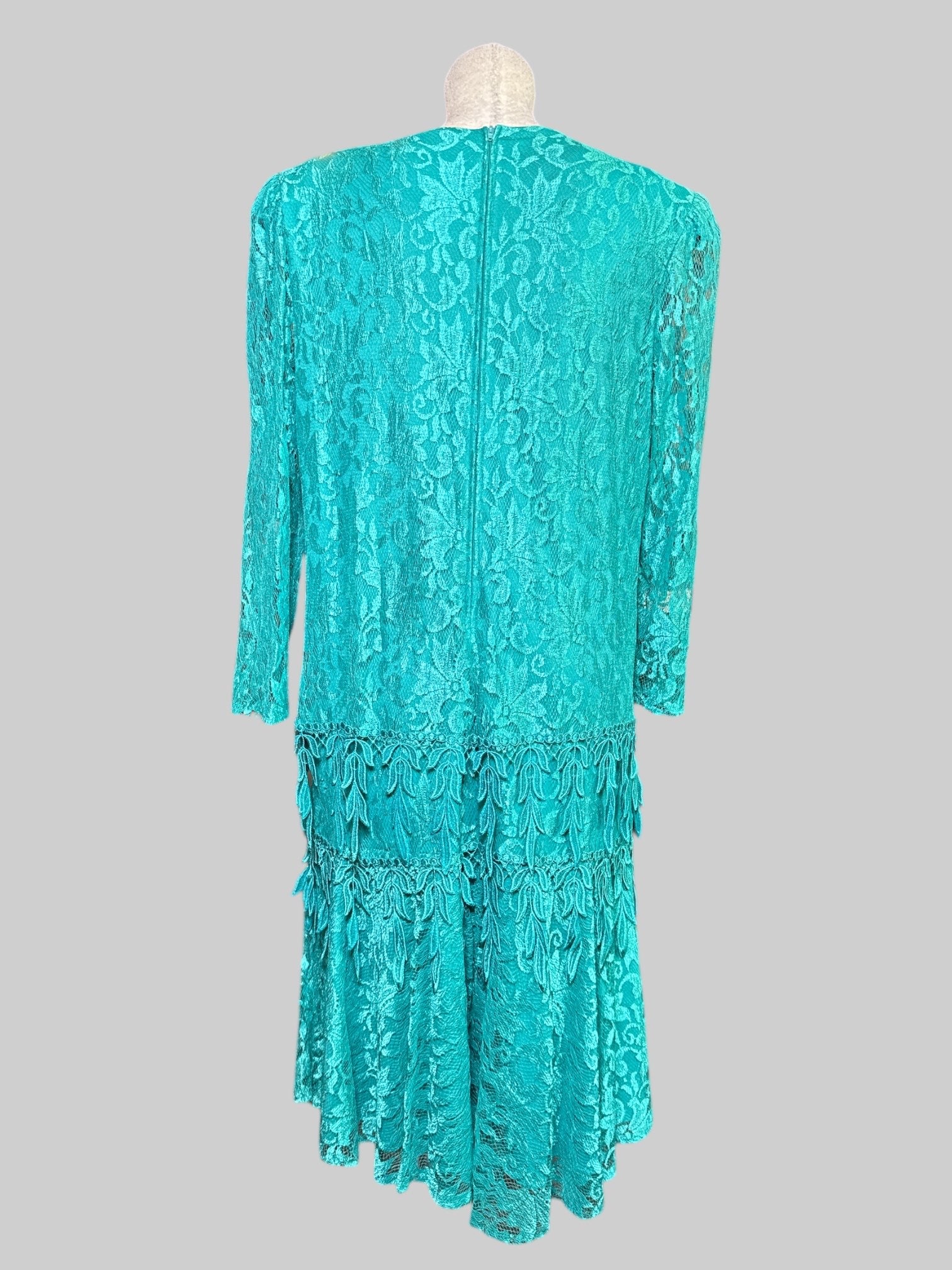 1X vintage teal tiered dress with sheer lace sleeves, shoulder pads, and beautiful florals and was made in the USA