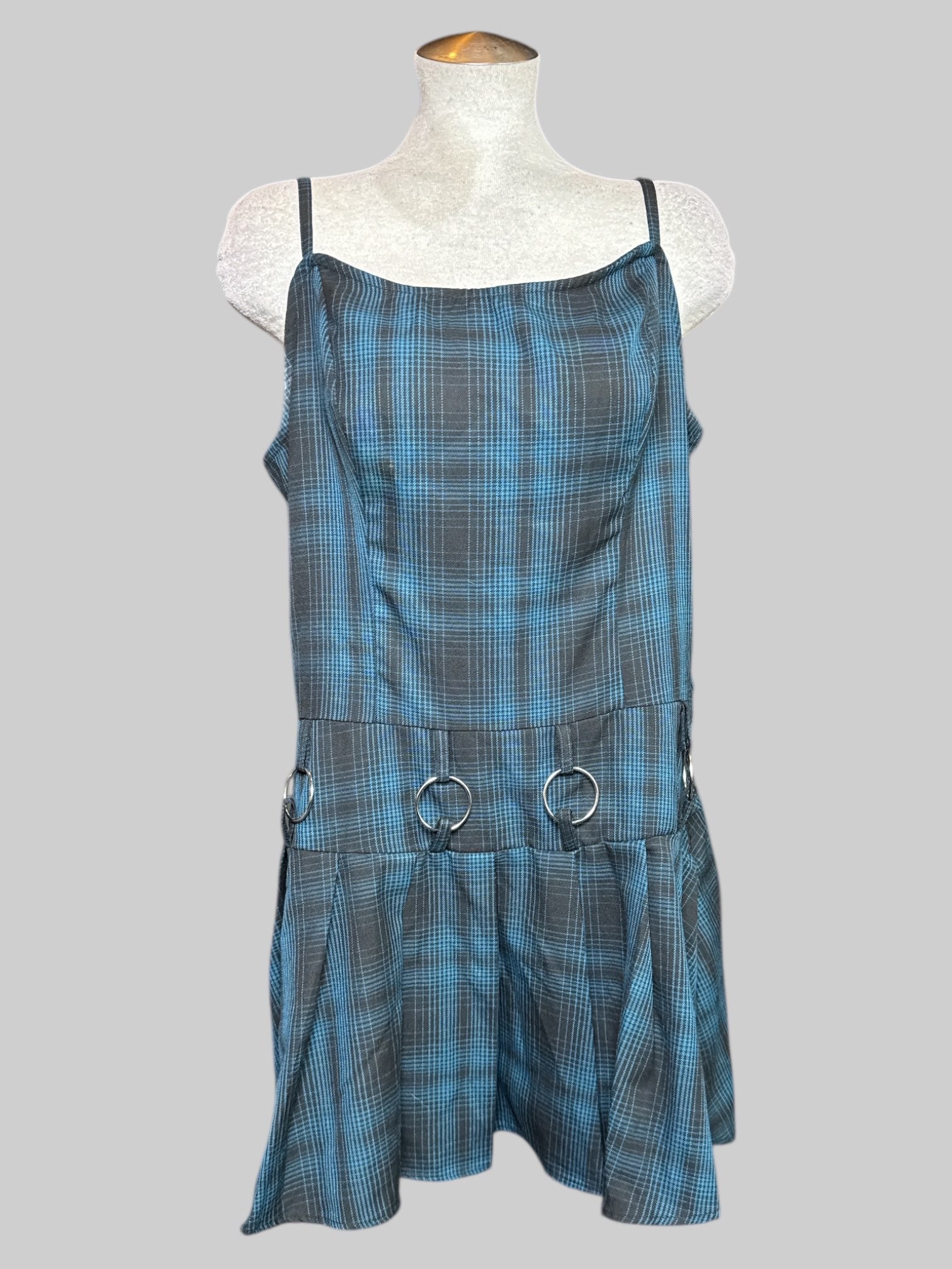 1X black and blue plaid sleeveless dress with shirred back, O rings, and pleated bottom
