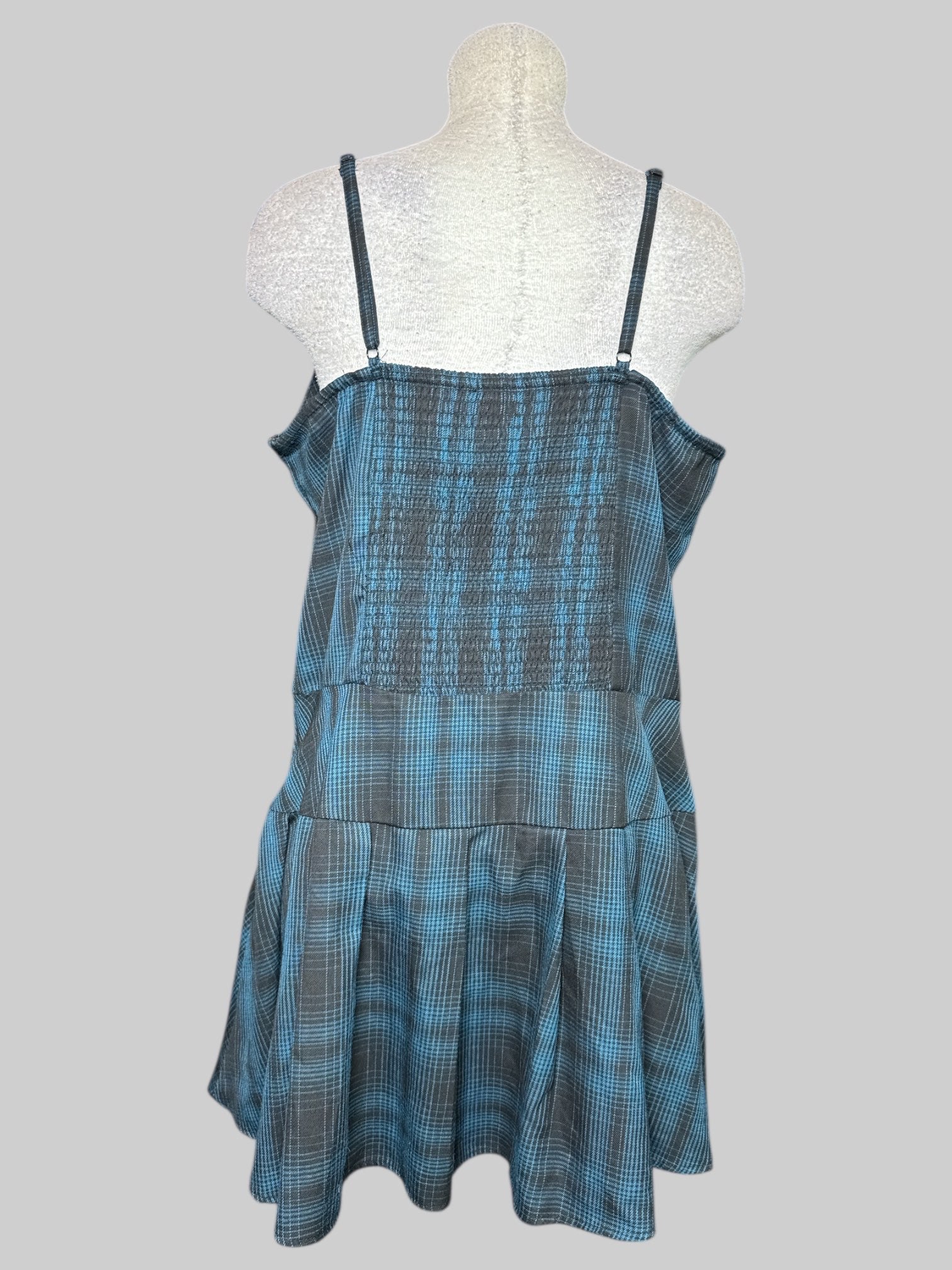1X black and blue plaid sleeveless dress with shirred back, O rings, and pleated bottom