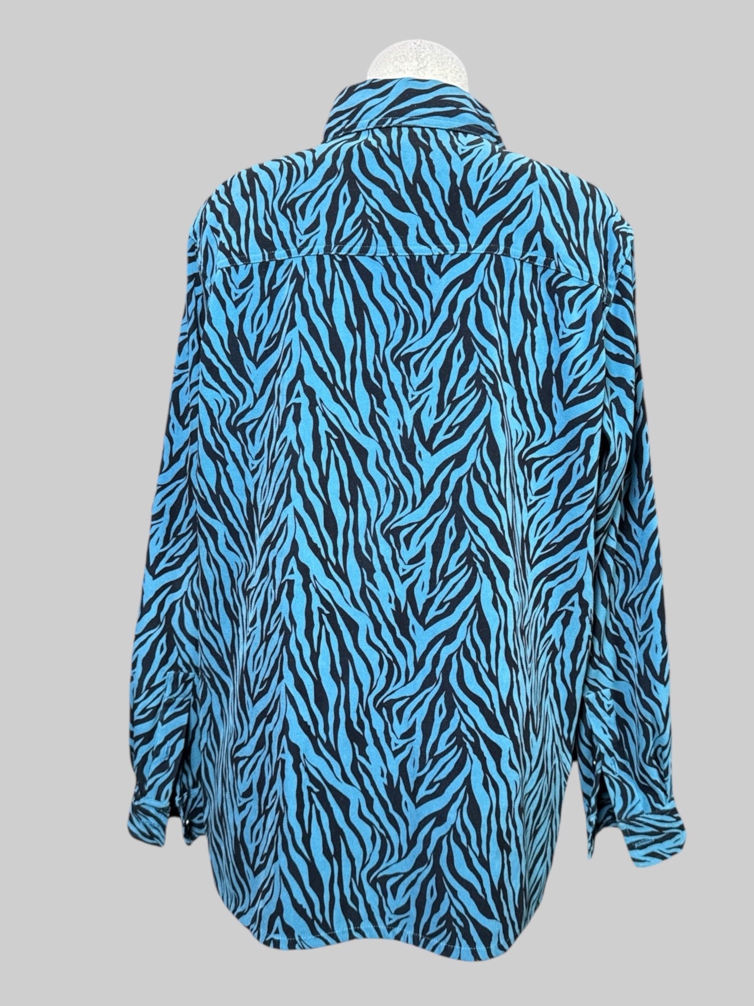 L Teal and black zebra print long sleeve top with pocket on front