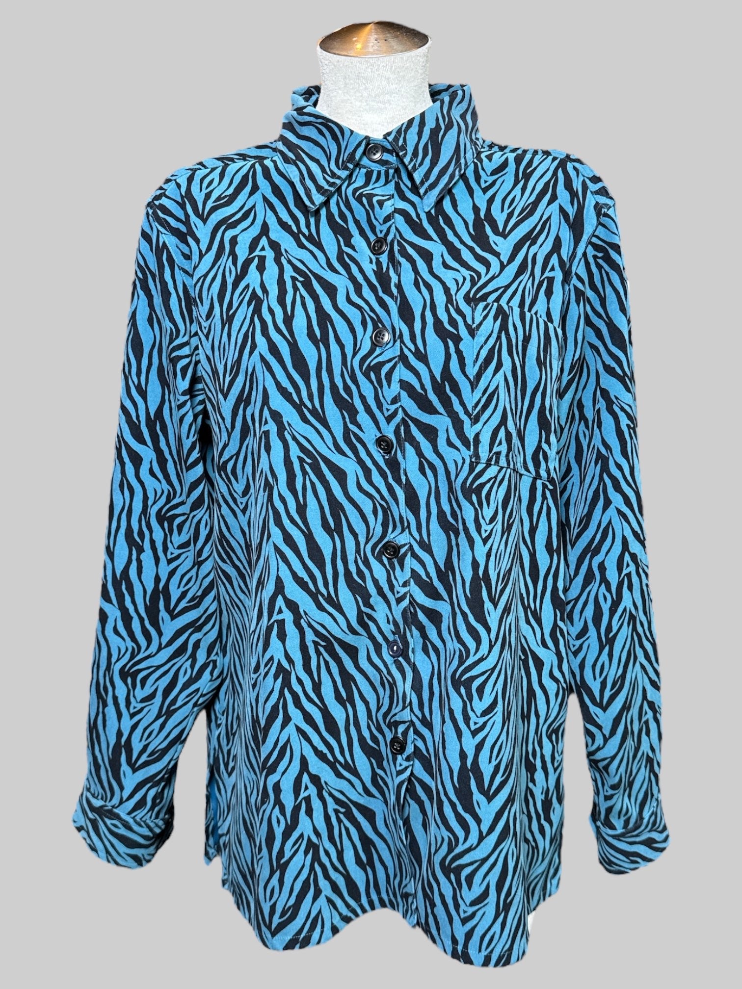 L Teal and black zebra print long sleeve top with pocket on front
