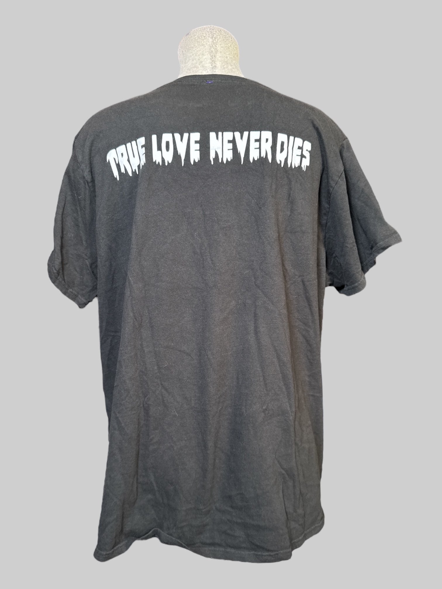 2X black T-shirt with The Nightmare before Christmas graphic on front, and “true love never dies” on back