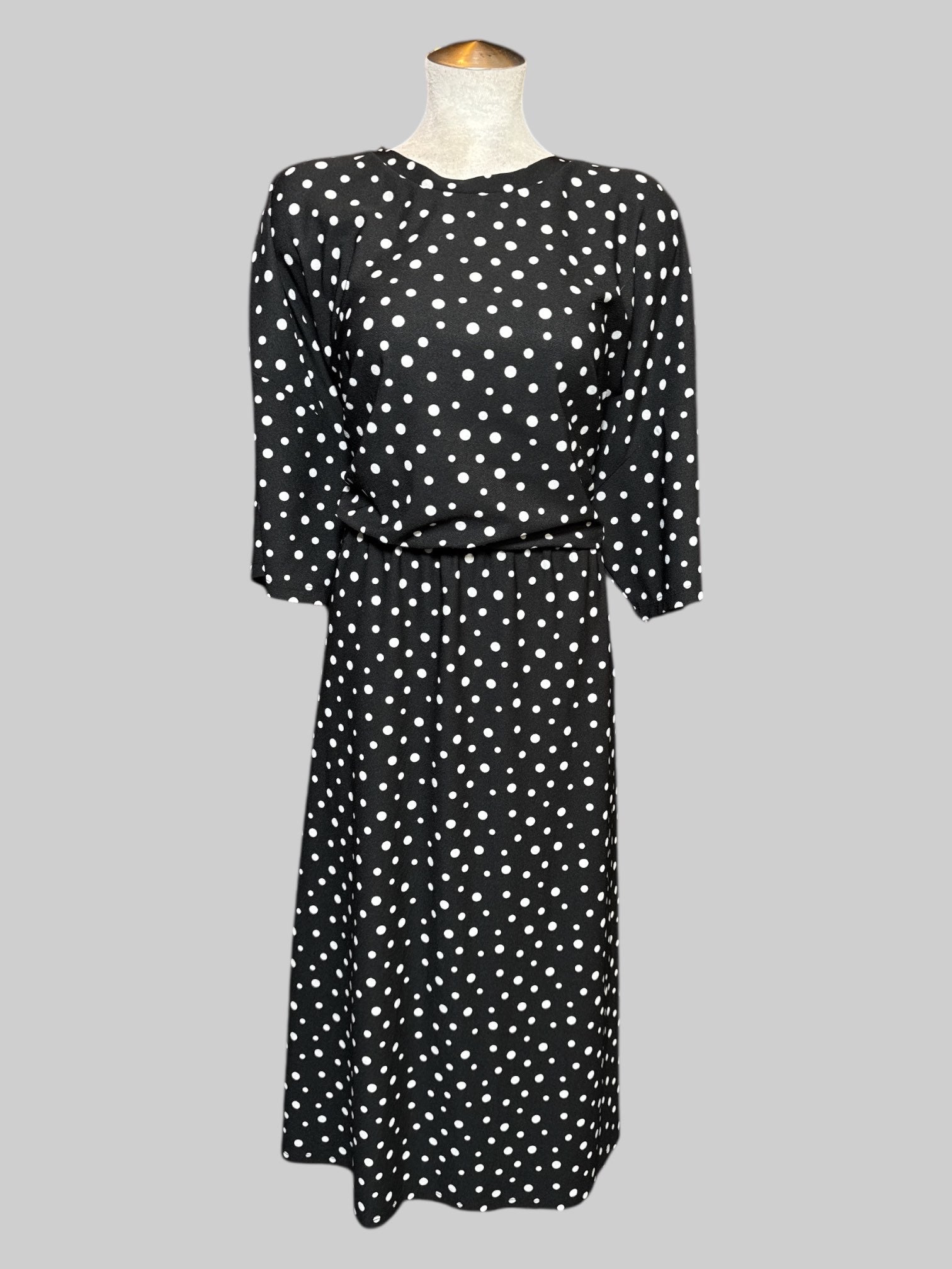 3X black and white polkadot short, free dress with elastic waistband, and mid drift cut on back