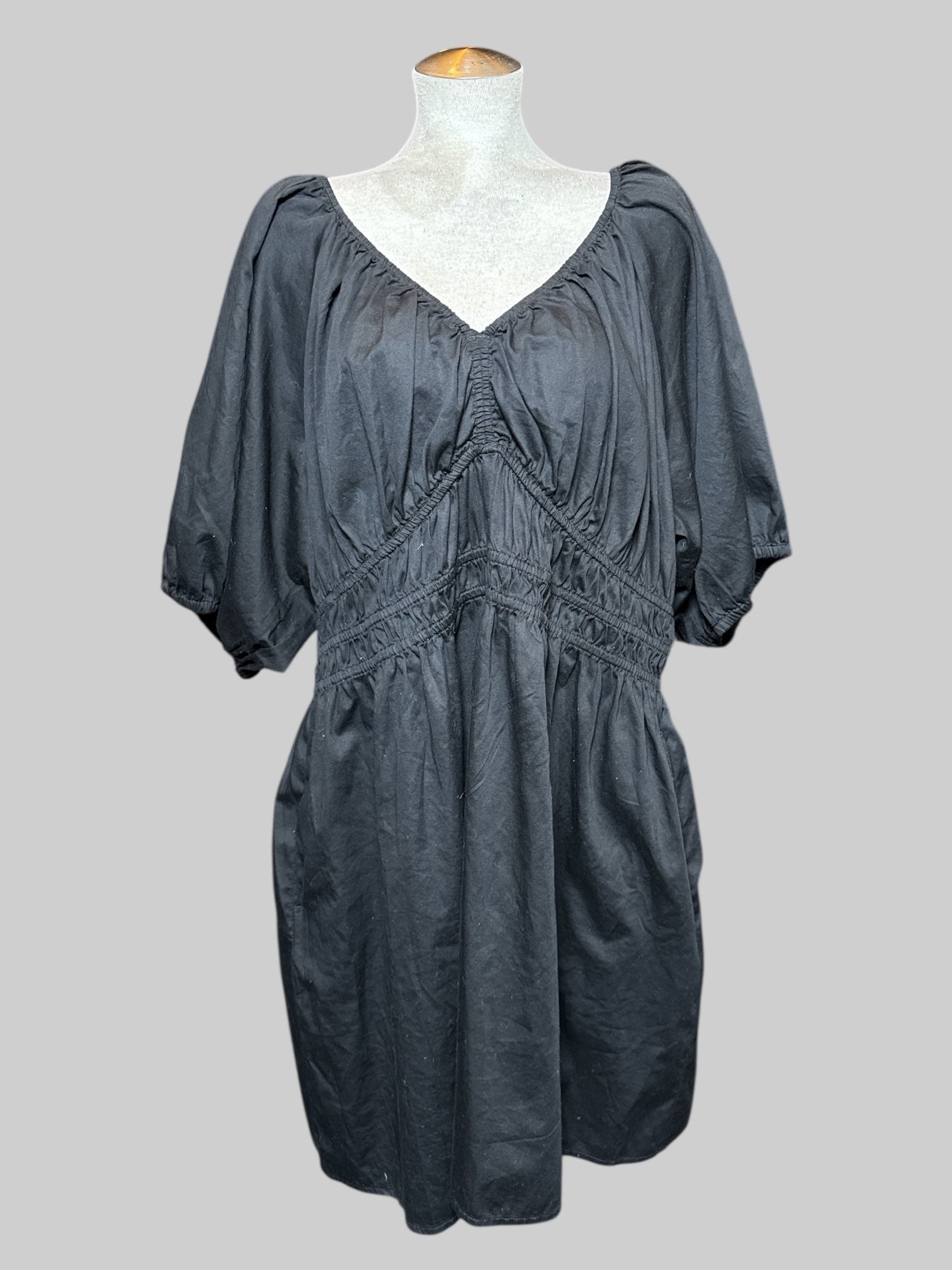 3X black, short sleeve dress with balloon sleeves, multiple elastic bands on waist and neck line, pockets, and tie on back