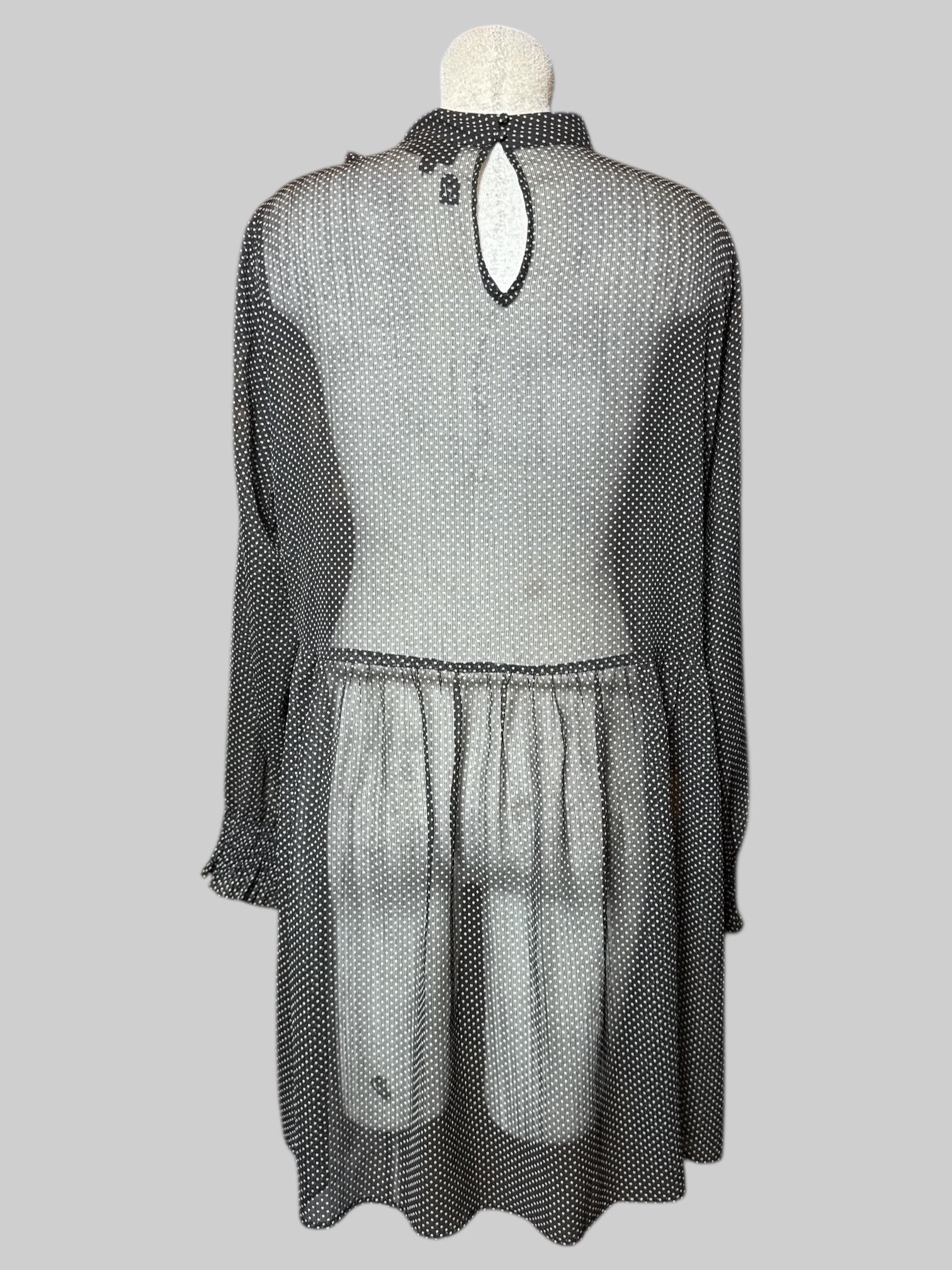 XL black and white polkadot, sheer, long sleeve dress with balloon sleeves, ruffle design on neckline, and keyhole with two buttons on back