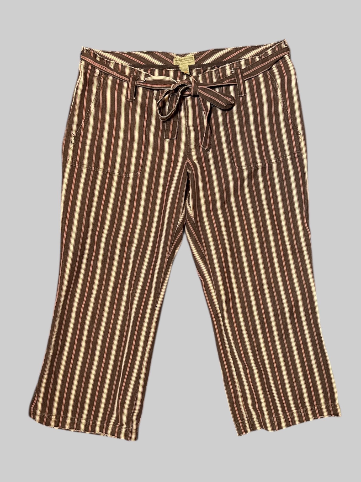 XL brown and multicolor striped pants with attached tie, belt, pockets, belt, loops, and zipper around front
