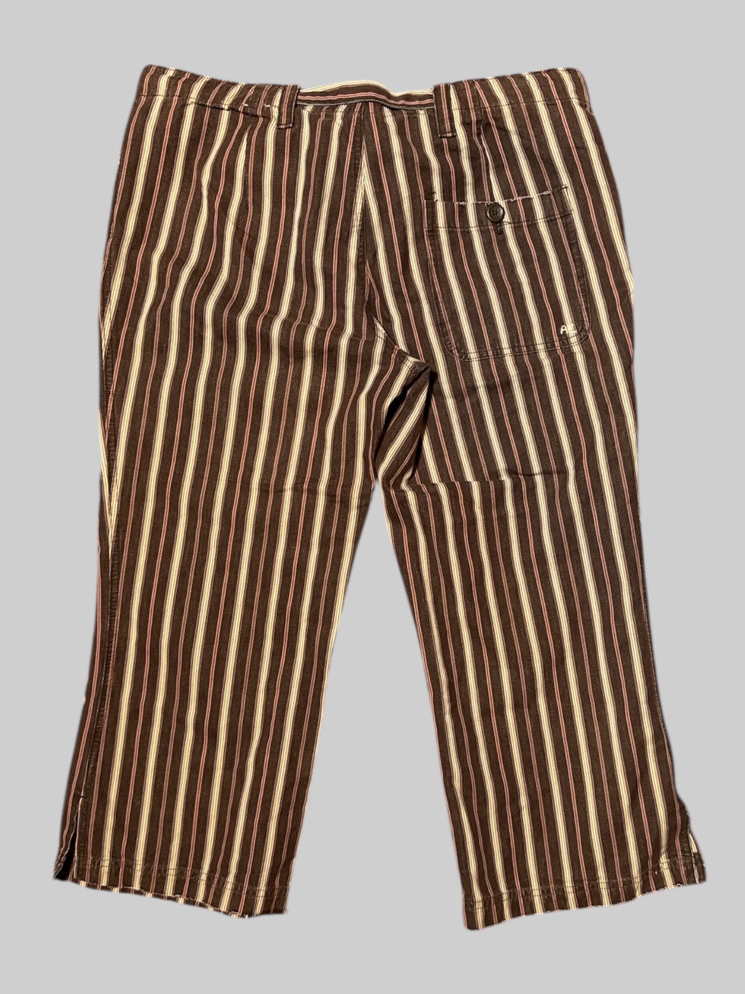 XL brown and multicolor striped pants with attached tie, belt, pockets, belt, loops, and zipper around front