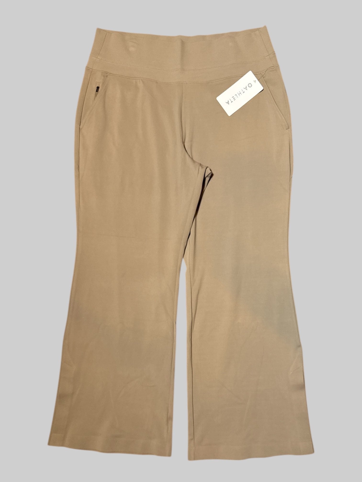 1X NWT beige workout pants with multiple pockets, including three zipper pockets