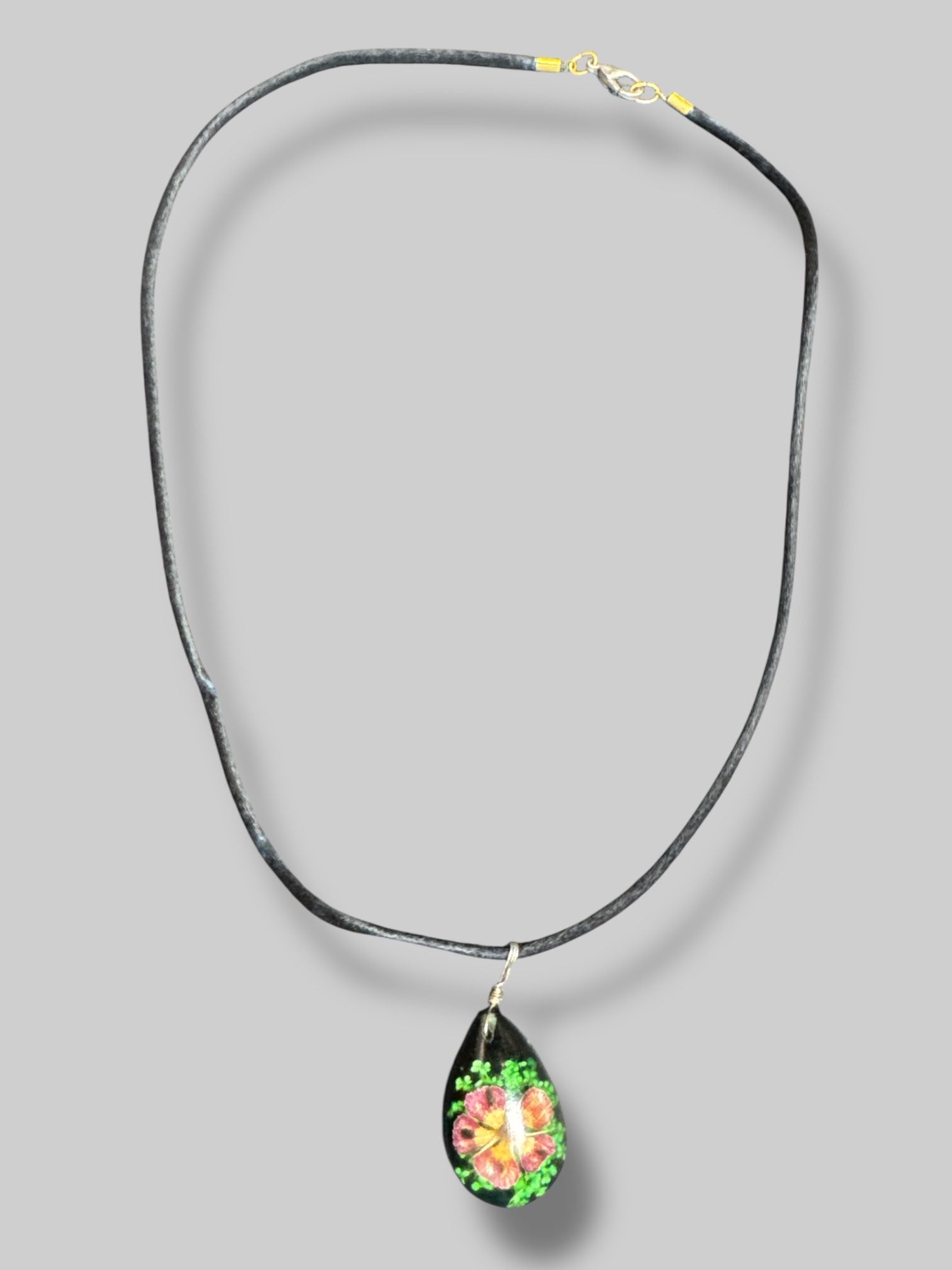 Black resin floral pendant necklace with black cord