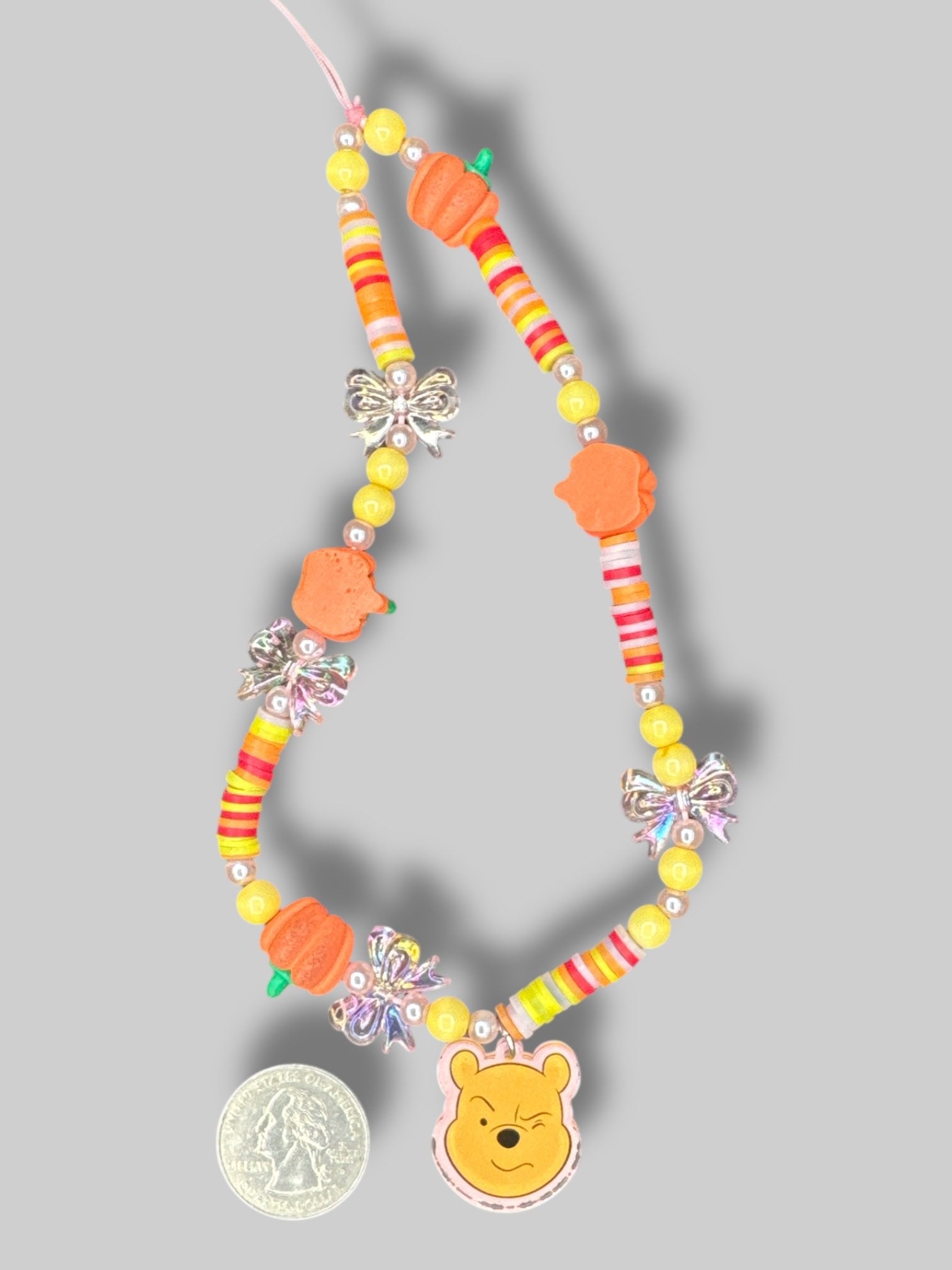 6” by 2.5” Winnie the Pooh phone case with charm