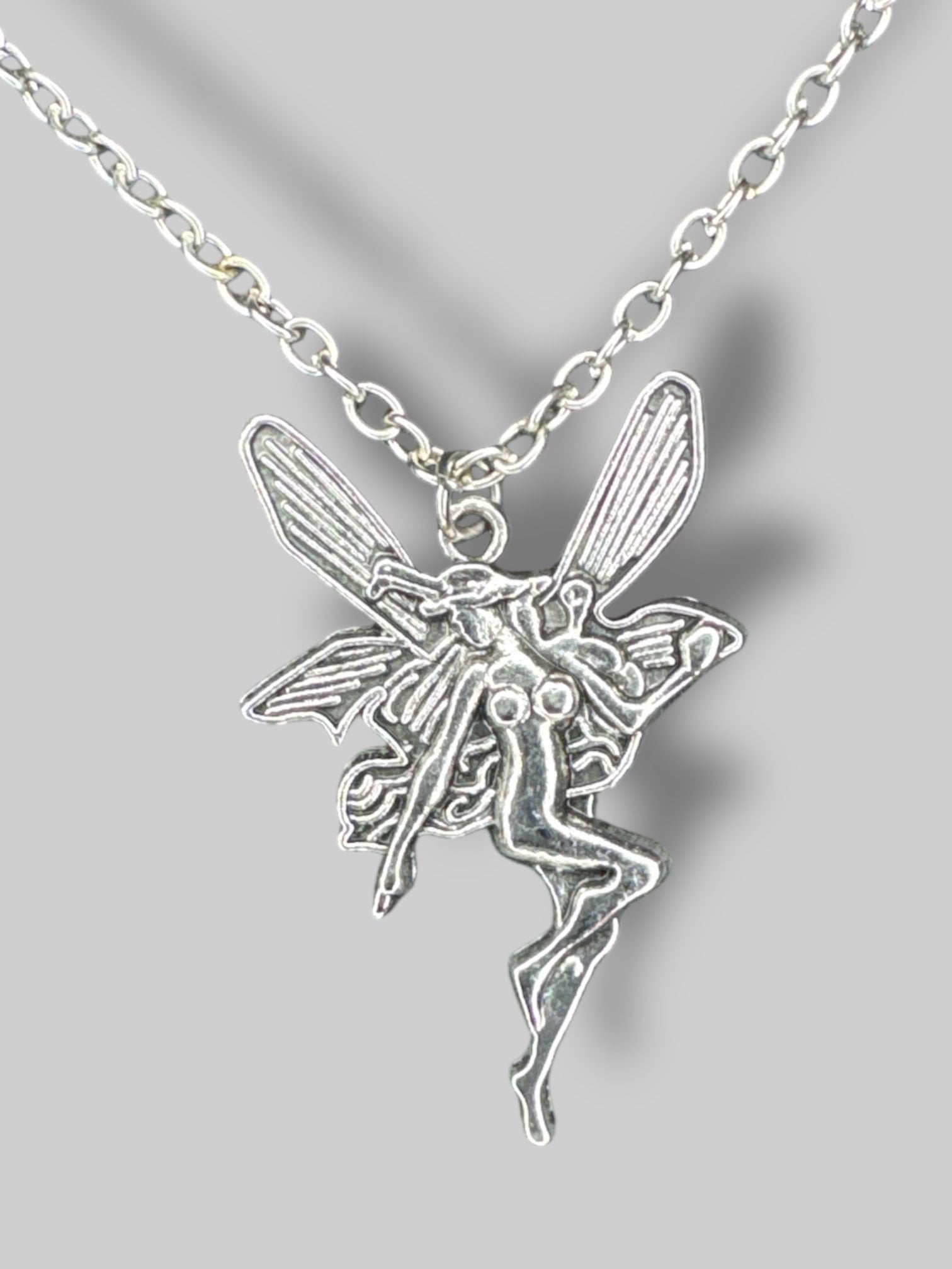 Silver tone necklace with fairy pendant
