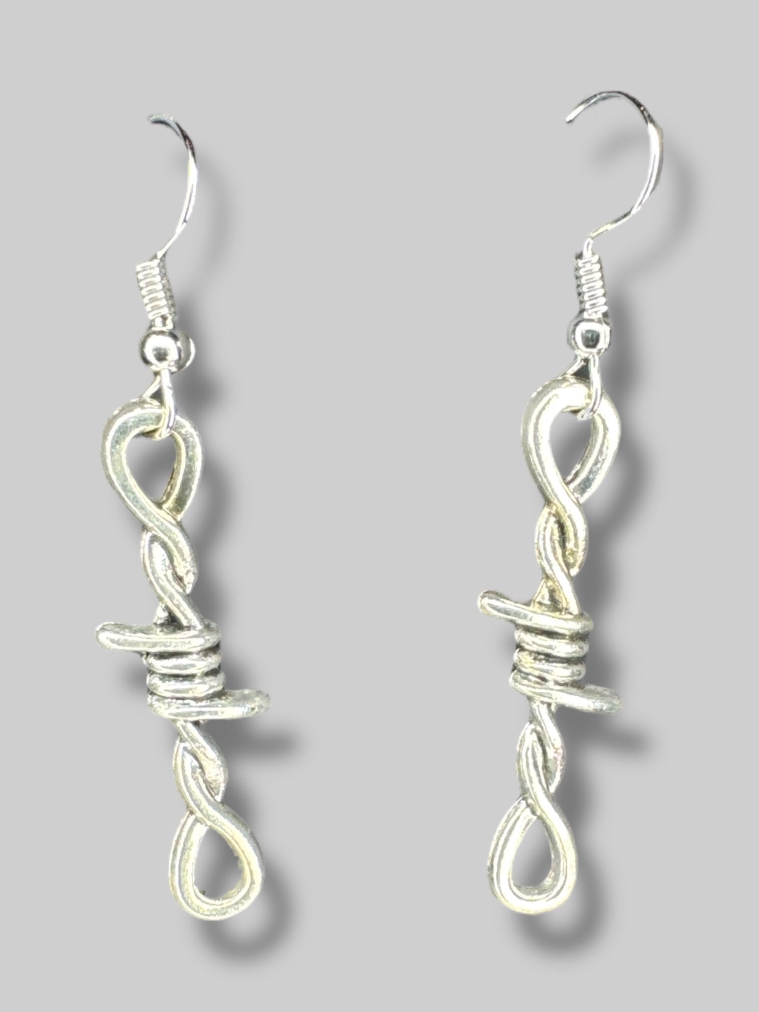 Silver tone barbed wire earrings
