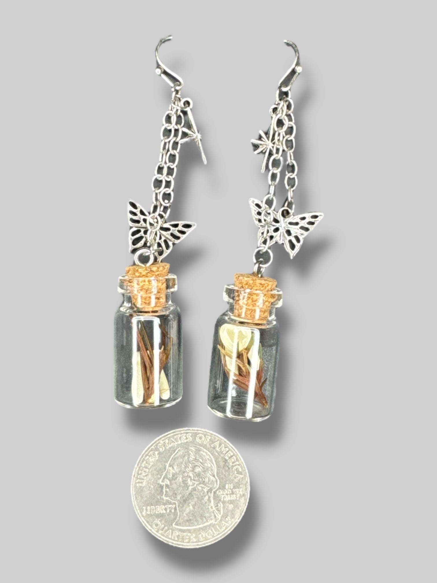 Jar earrings with fake teeth and butterflies on chain