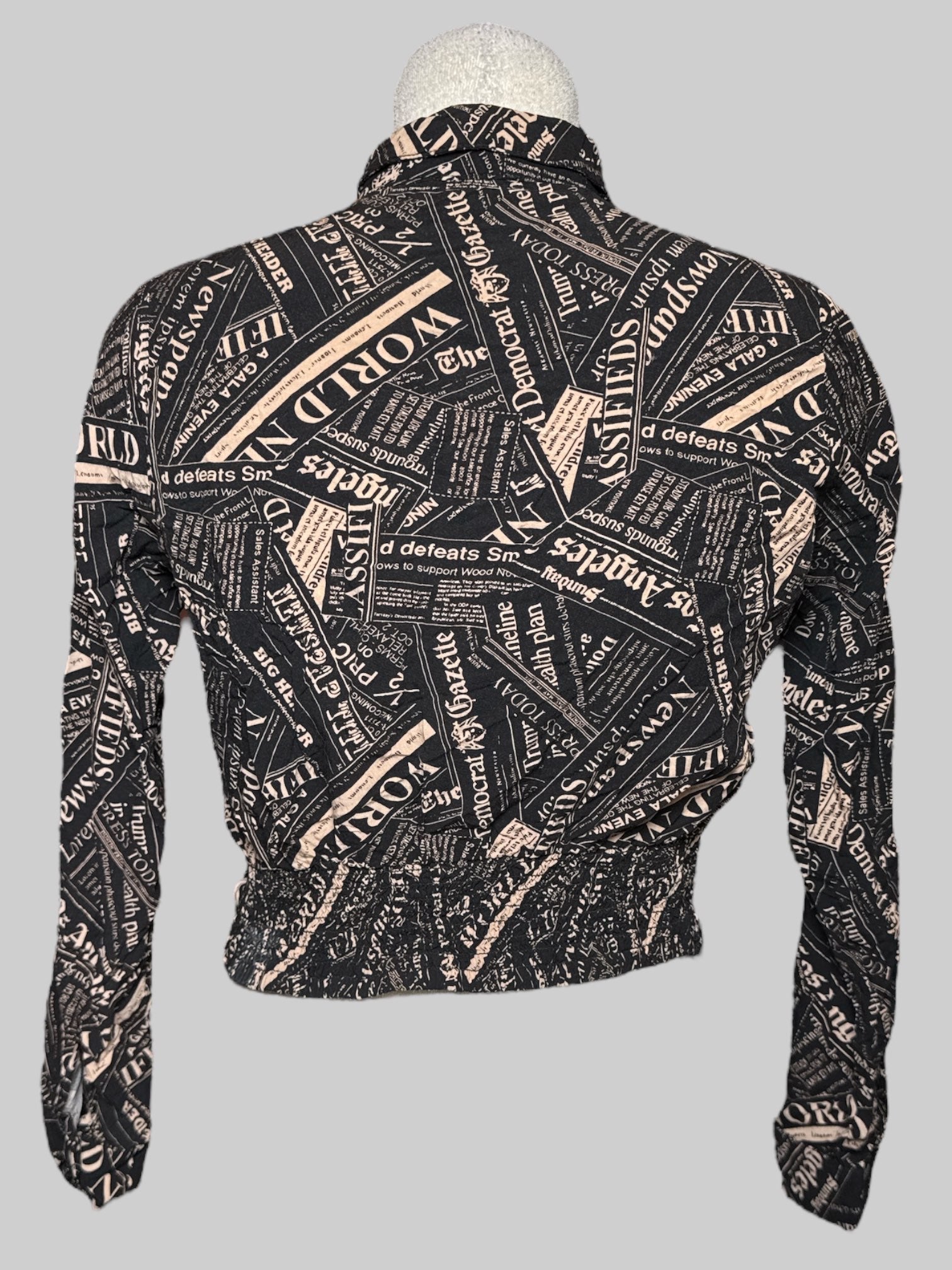 S Milk & Honey cropped twist button up with news print and shirred back