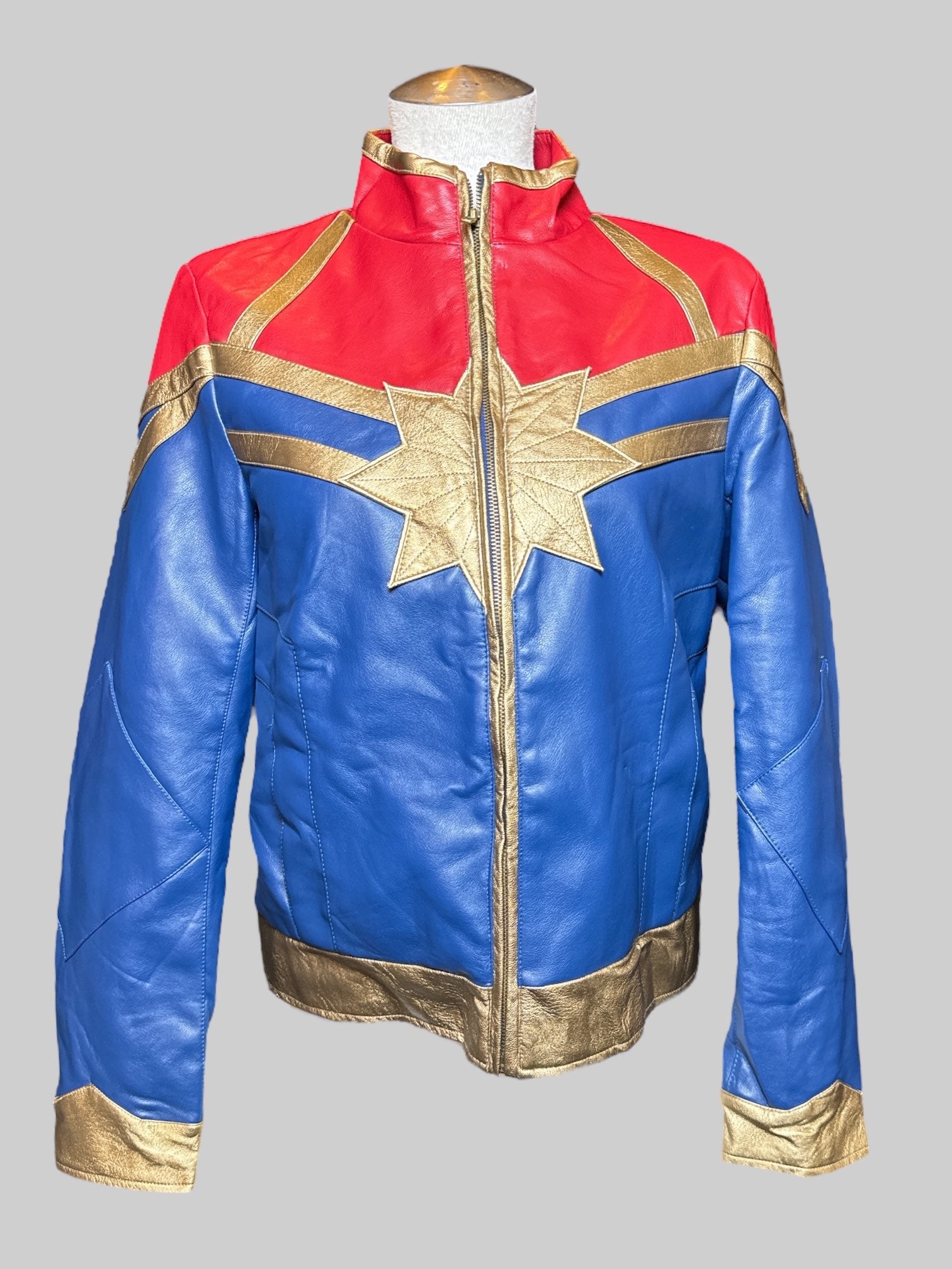 M Marvel blue, red and gold Captain Marvel jacket