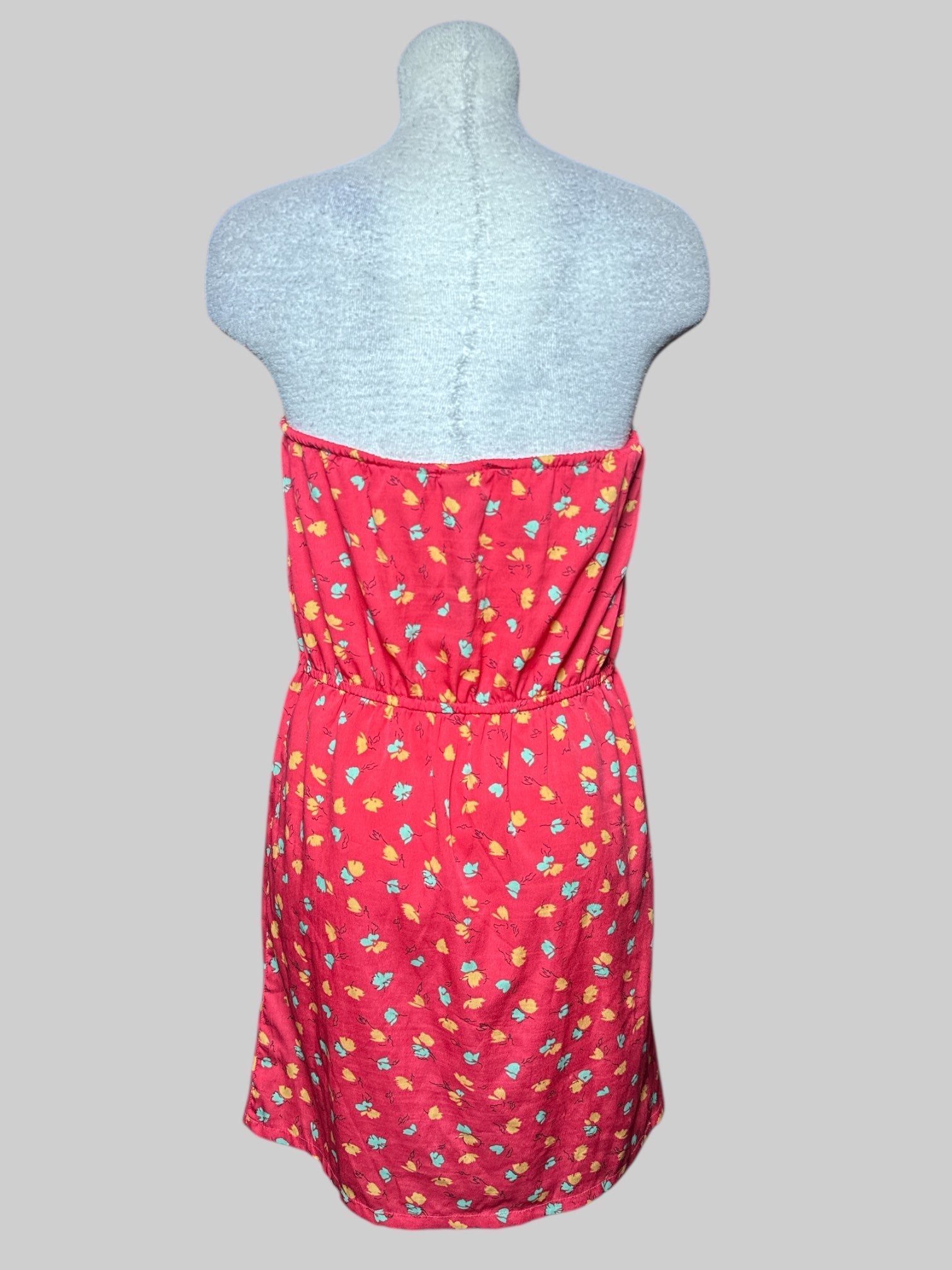 L O’ NEILL red strapless dress with drawstring and yellow, green, and black florals