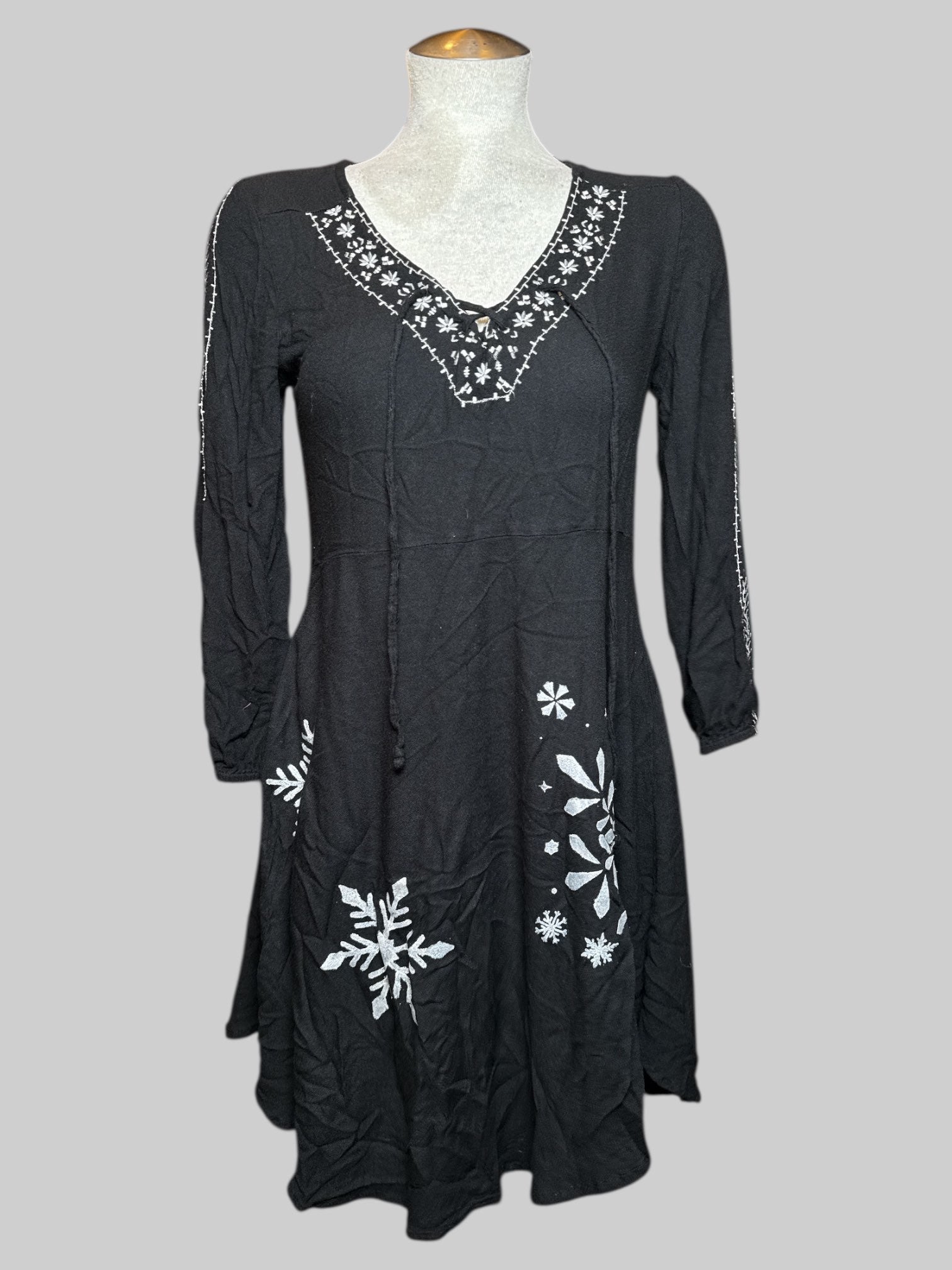 M Mudd black dress with white embroidery, string, and hand painted snow flakes