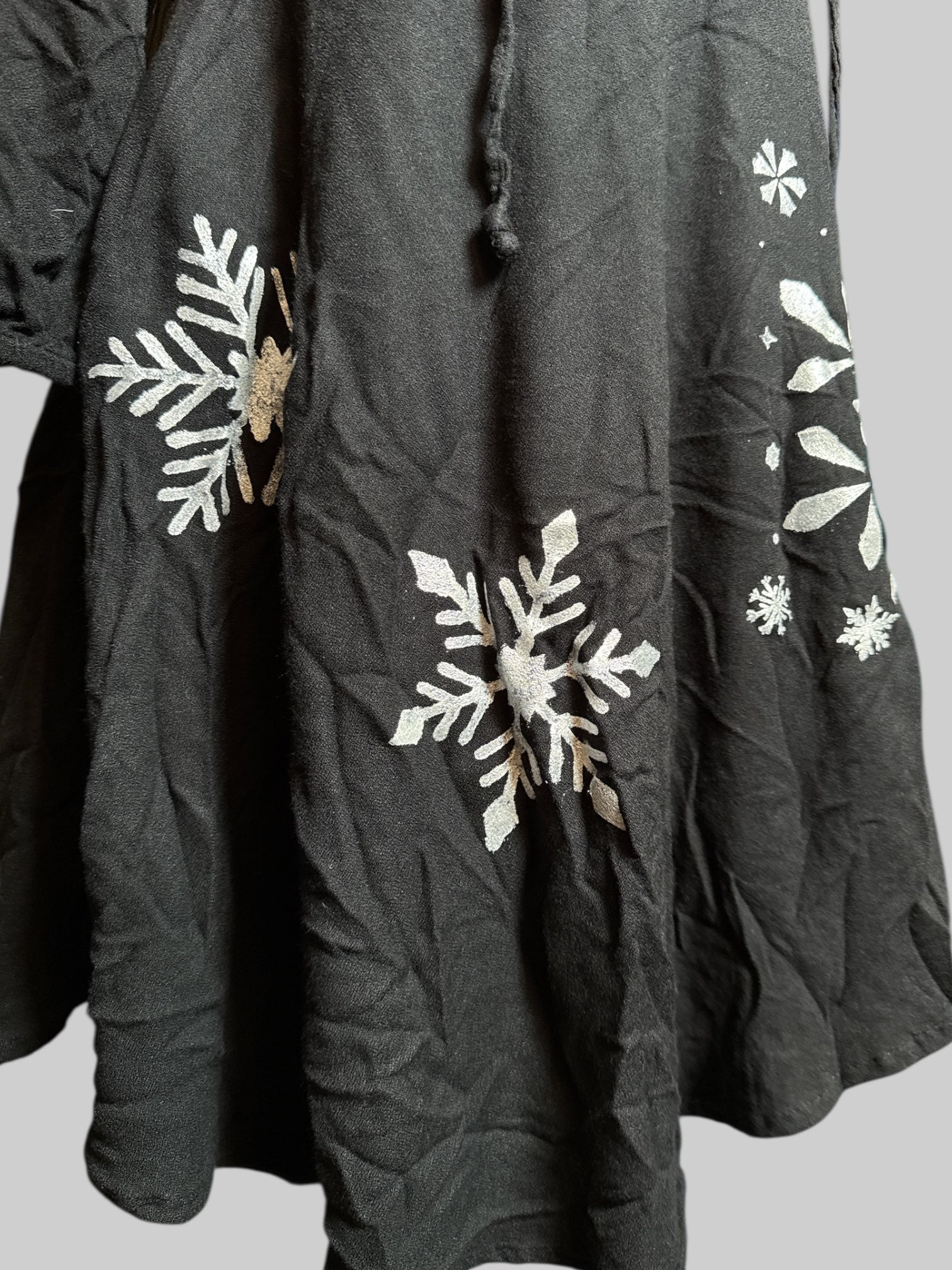 M Mudd black dress with white embroidery, string, and hand painted snow flakes