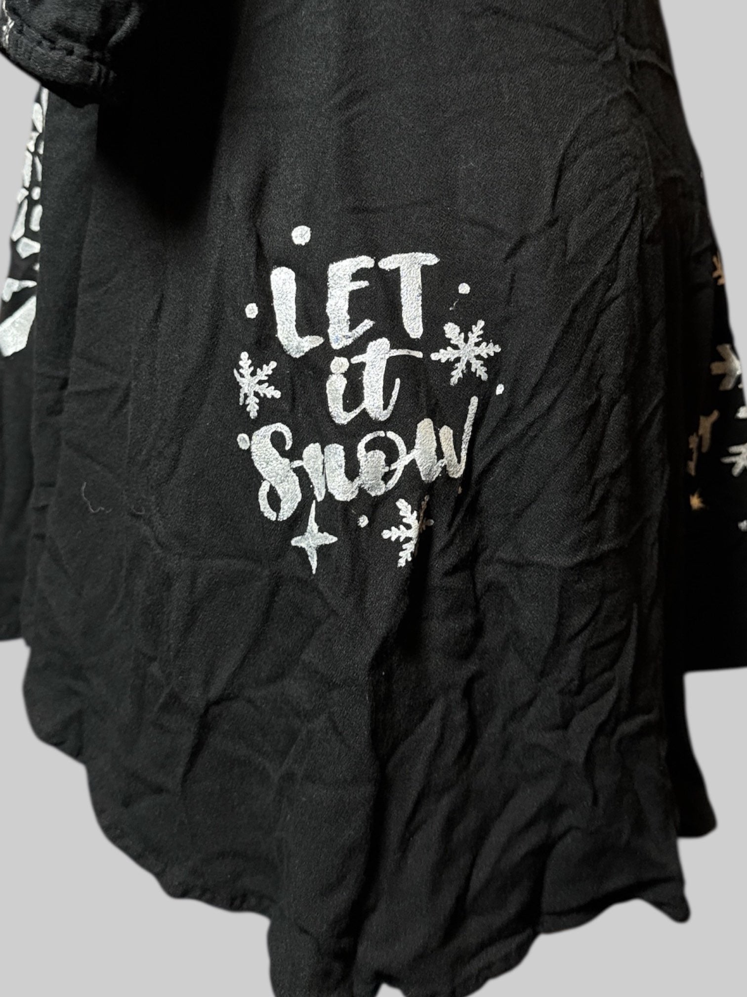 M Mudd black dress with white embroidery, string, and hand painted snow flakes