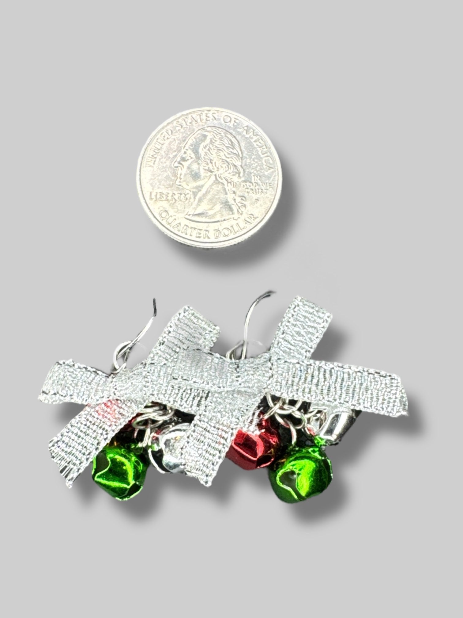 Silver bow earrings with jingle bells