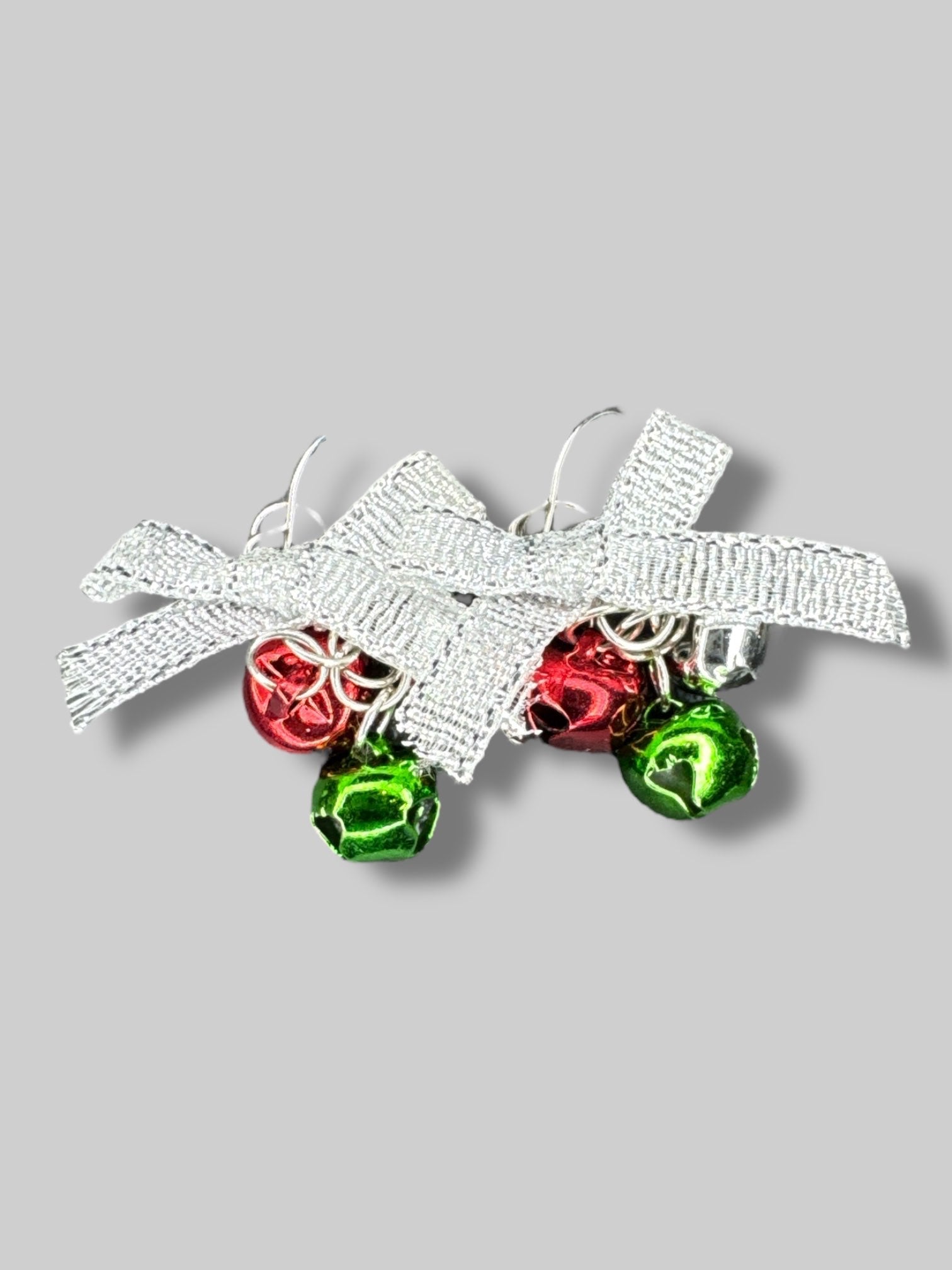 Silver bow earrings with jingle bells
