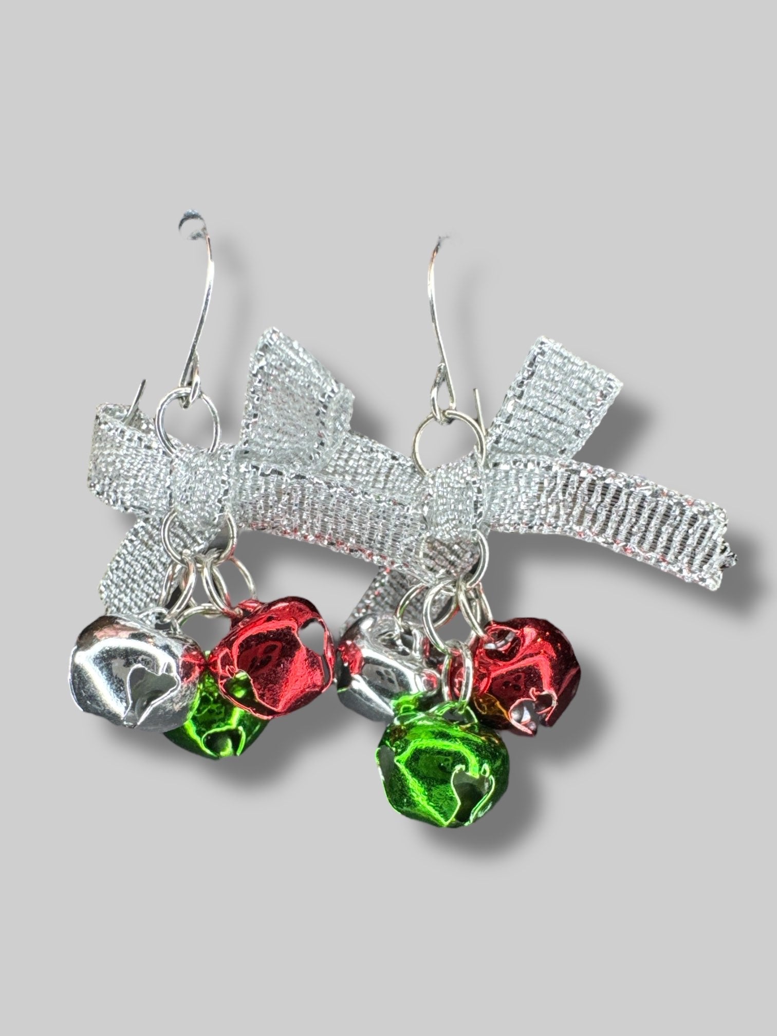 Silver bow earrings with jingle bells