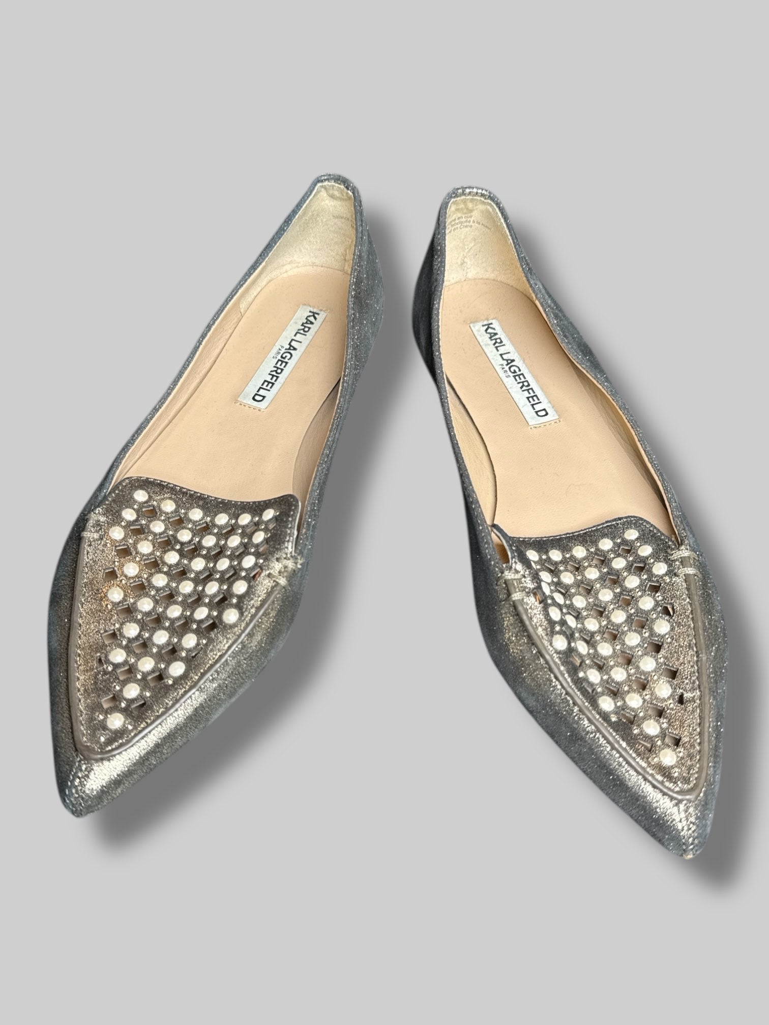 Size 7.5M Karl Lagerfeld silver pointy flats with faux pearls and cutout design on toes