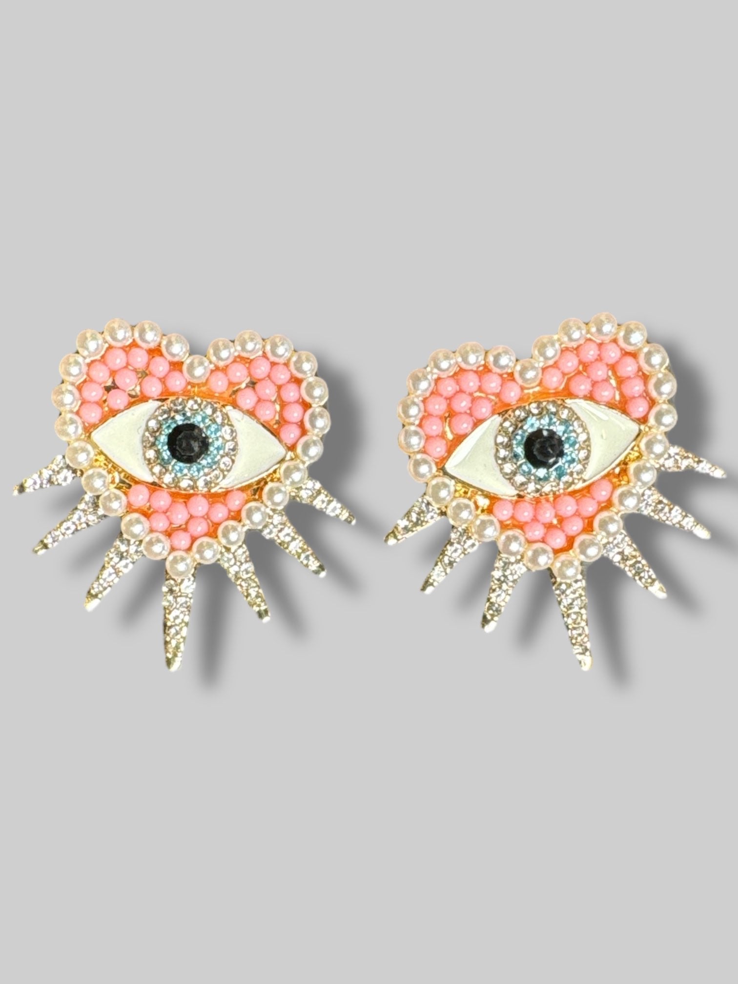 1” Pink and pearl heart shaped earrings with eyes and bedazzling