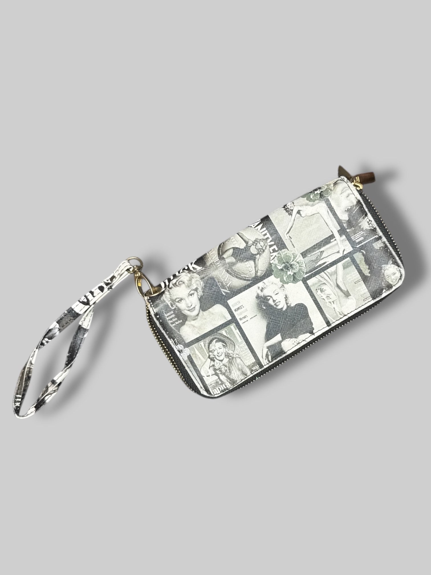 7” by 3” wallet with greyscale magazine covers