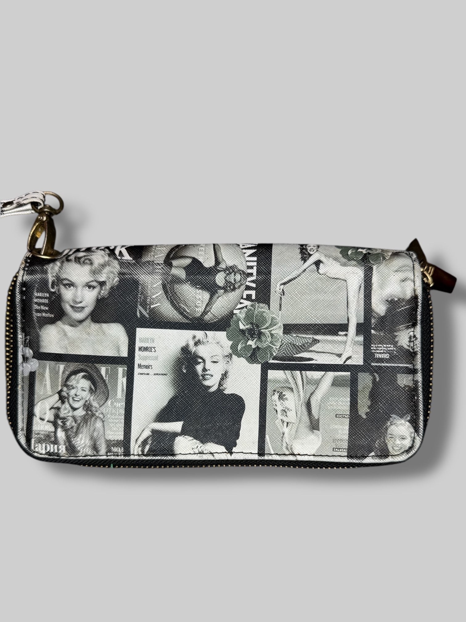 7” by 3” wallet with greyscale magazine covers