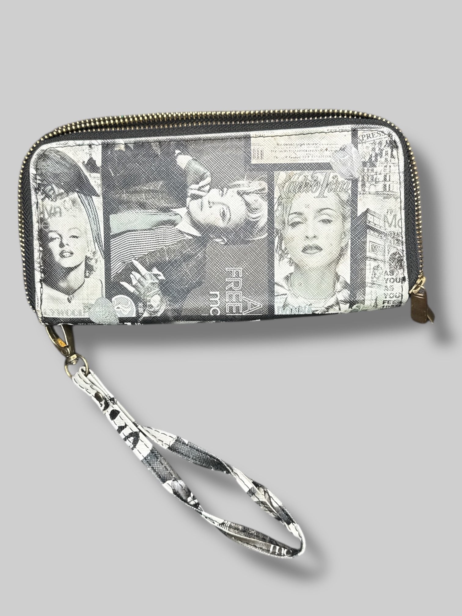 7” by 3” wallet with greyscale magazine covers