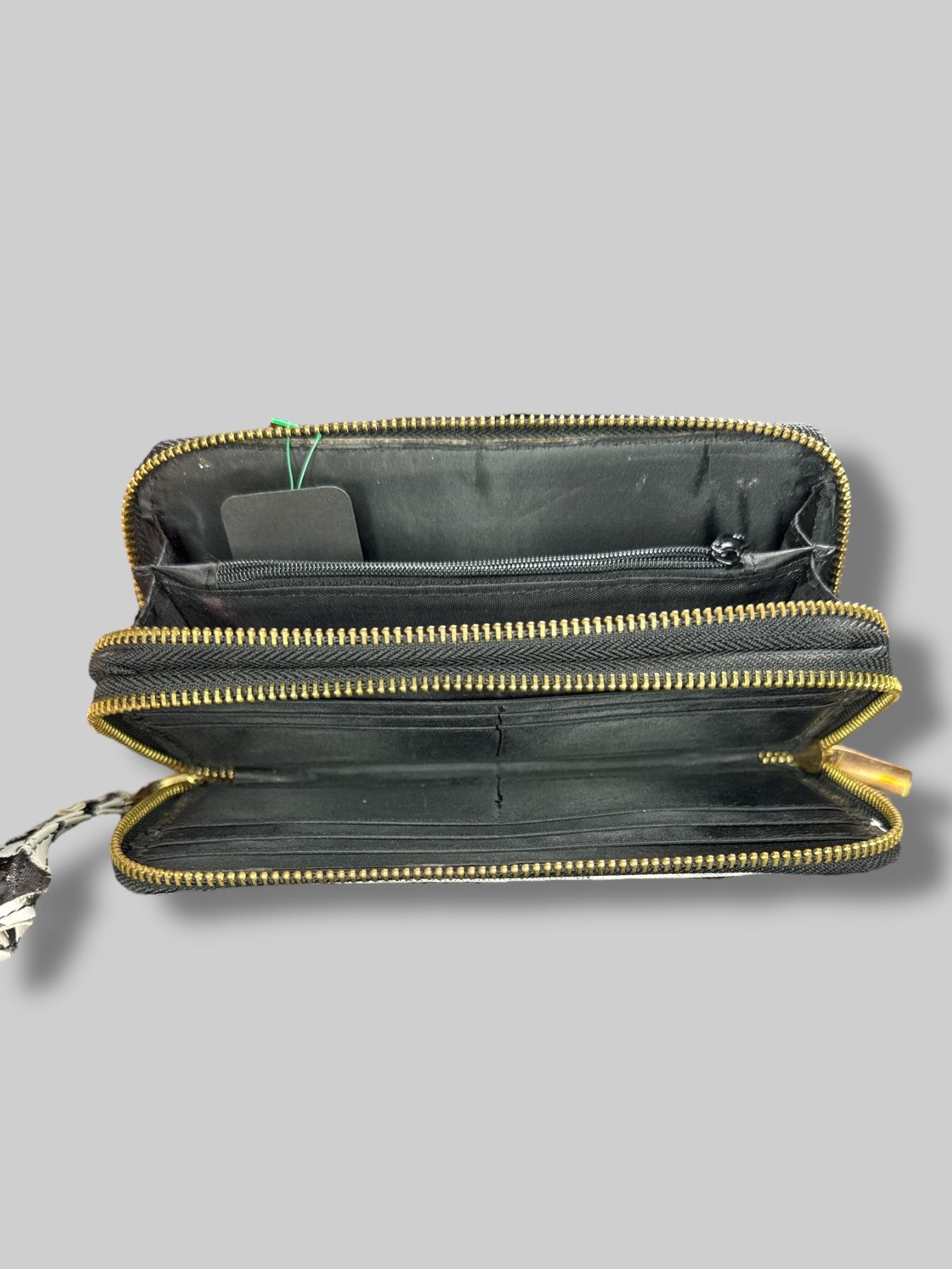 7” by 3” wallet with greyscale magazine covers