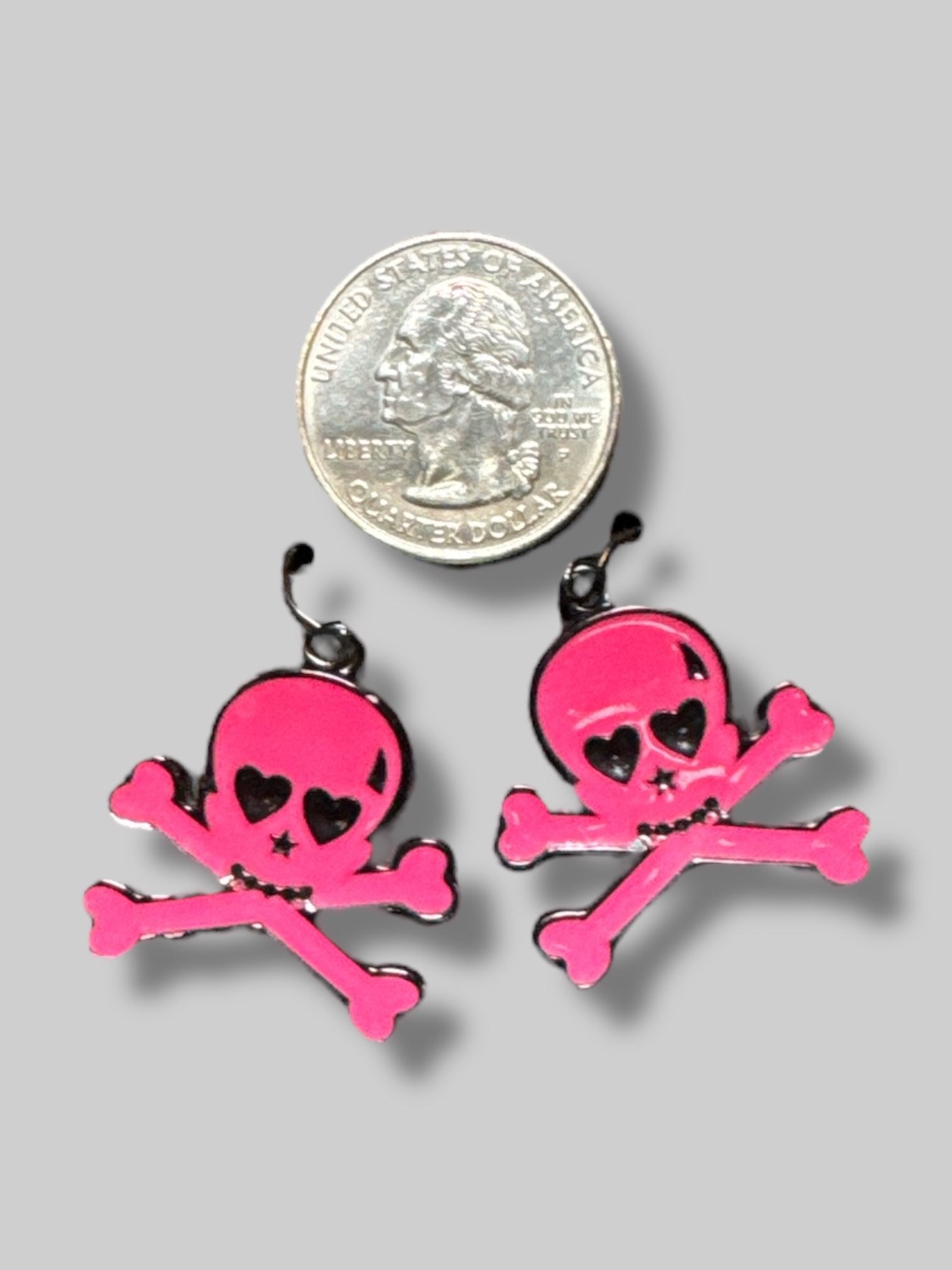Pink skull and crossbones earrings