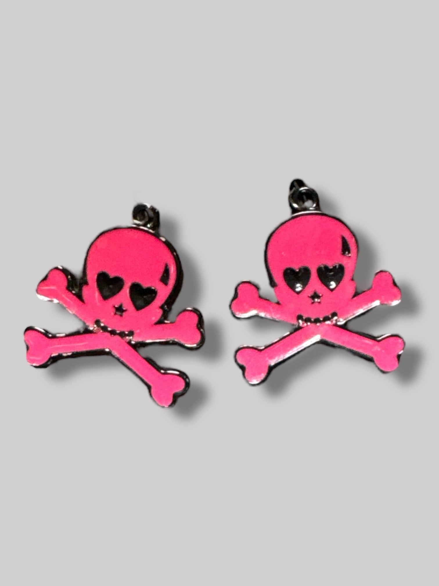 Pink skull and crossbones earrings